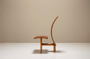 Architectural_Curved-back_Chair_in_Wood_1980s