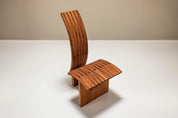 Architectural_Curved-back_Chair_in_Wood_1980s