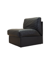 Black_leather_pouffe_armchair_Italian_design_1960s_production_Italy