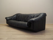 Black_leather_sofa_Italian_design_1960s_production_Italy