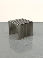 Eichholtz_Carlisle_side_table_in_polished_stainless_steel