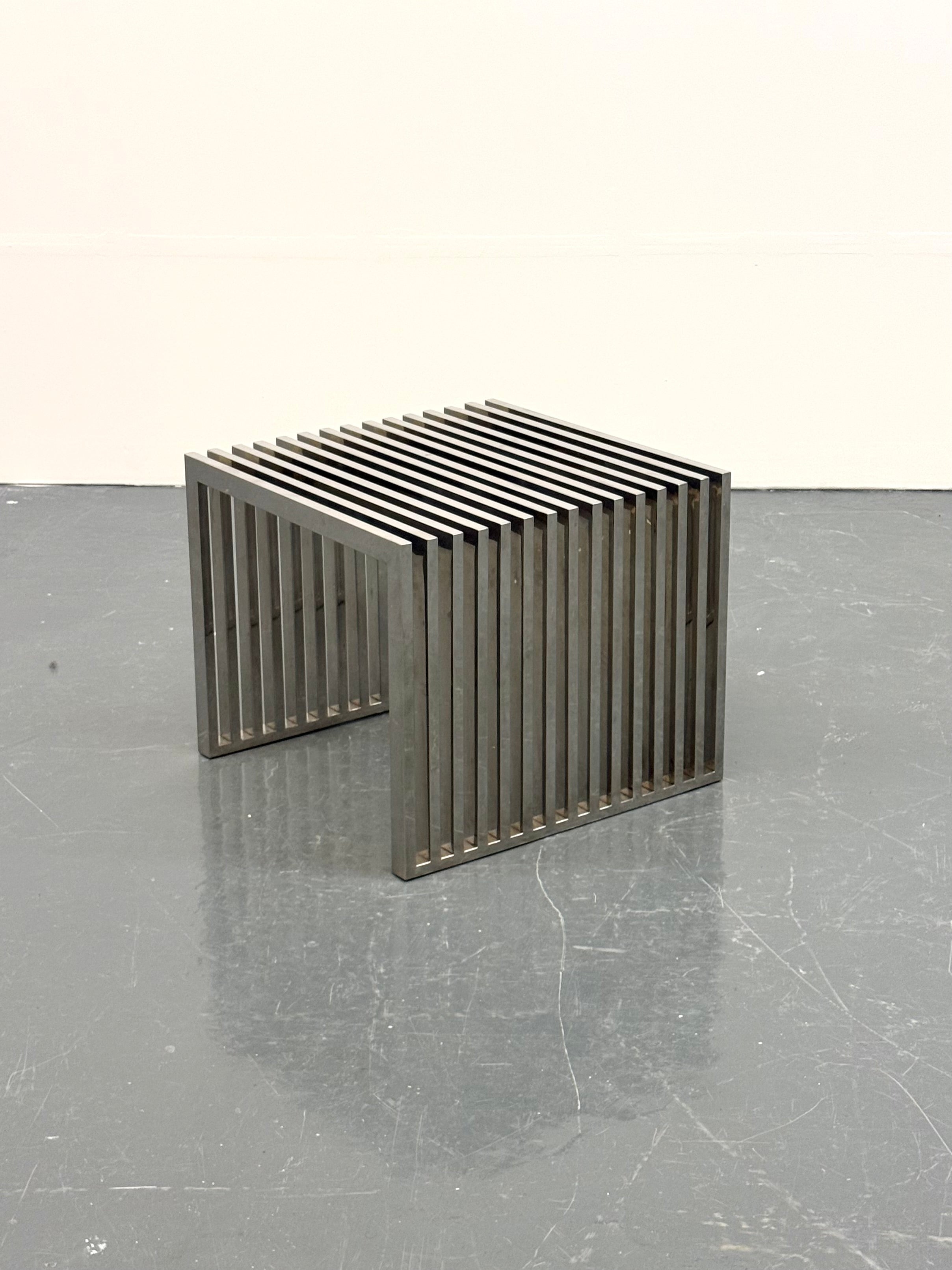 Eichholtz_Carlisle_side_table_in_polished_stainless_steel