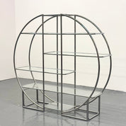 Round_Bauhaus_shelving_with_tubular_frame_and_glass_shelves