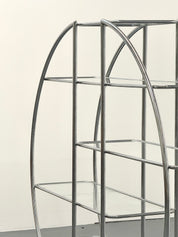 Round_Bauhaus_shelving_with_tubular_frame_and_glass_shelves