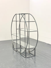 Round_Bauhaus_shelving_with_tubular_frame_and_glass_shelves