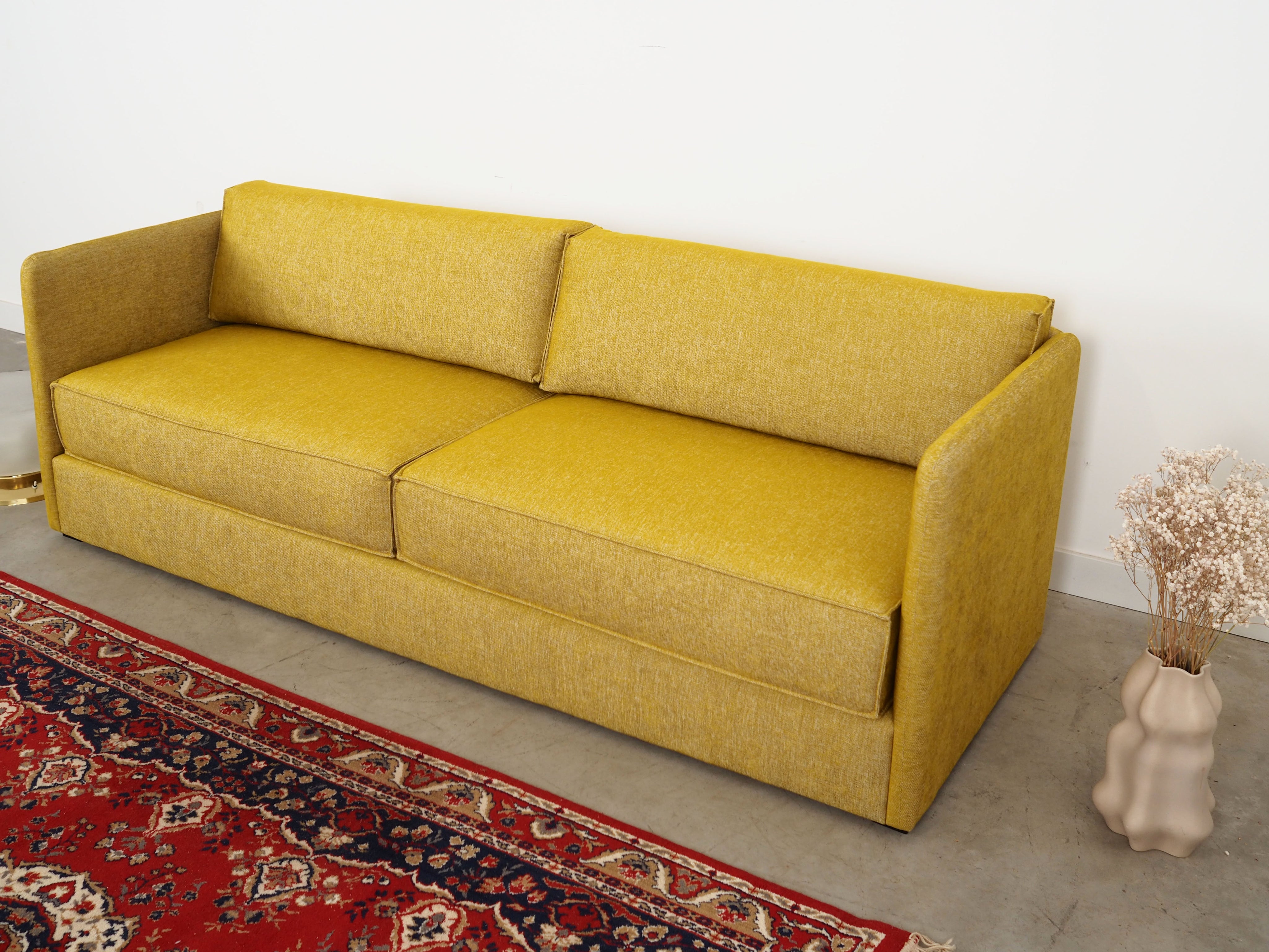 Yellow_sofa_in_Scandinavian_design_from_2000s