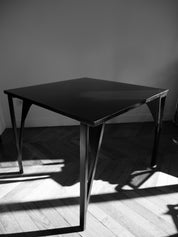 Table_and_4_chairs_set_by_Achille_&_Pier_Giacomo_Castiglioni,_1965.