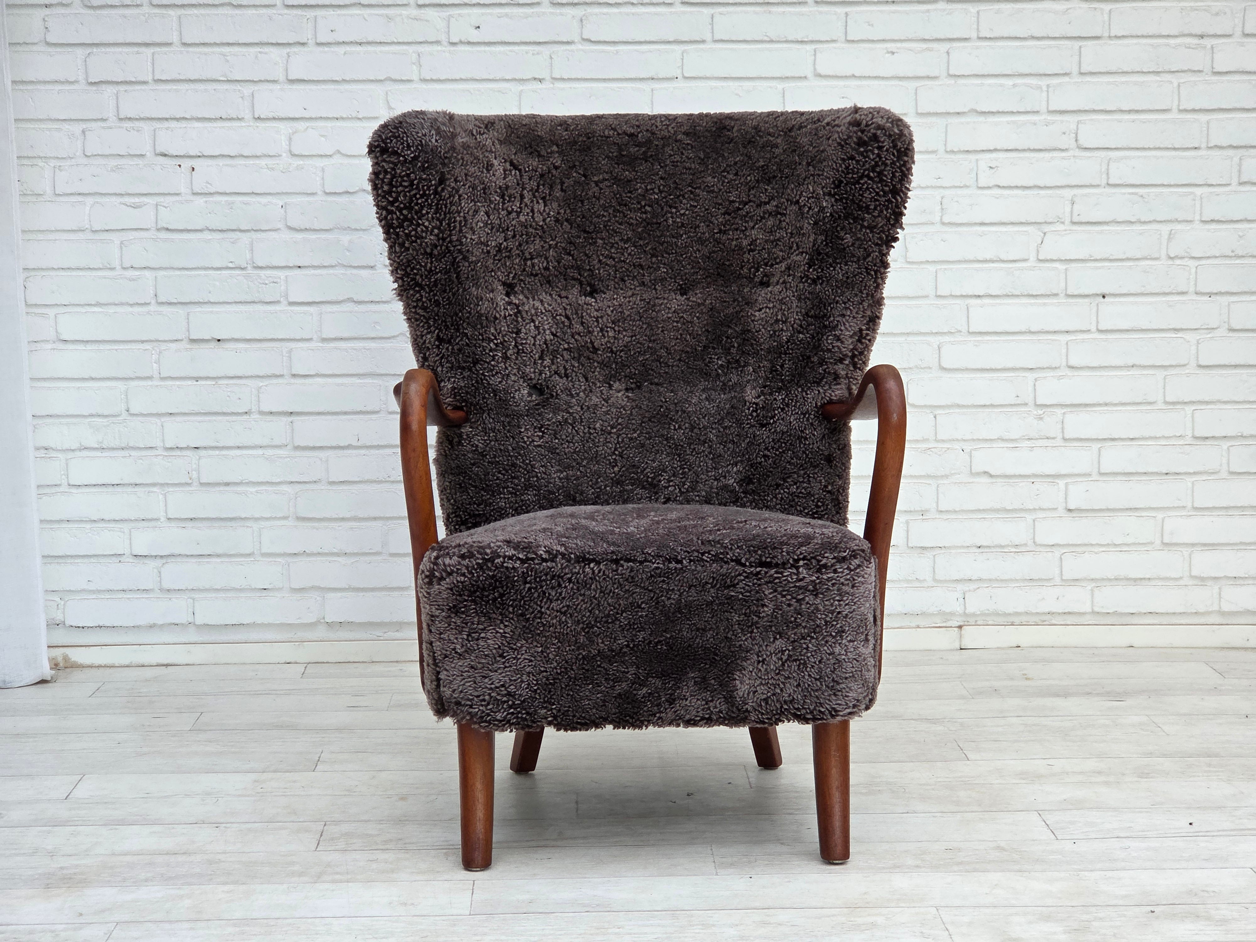 Danish_Mid-Century_Modern_Beech_Armchair_with_Genuine_Sheepskin_Upholstery_and_Leather_Buttons,_1960s