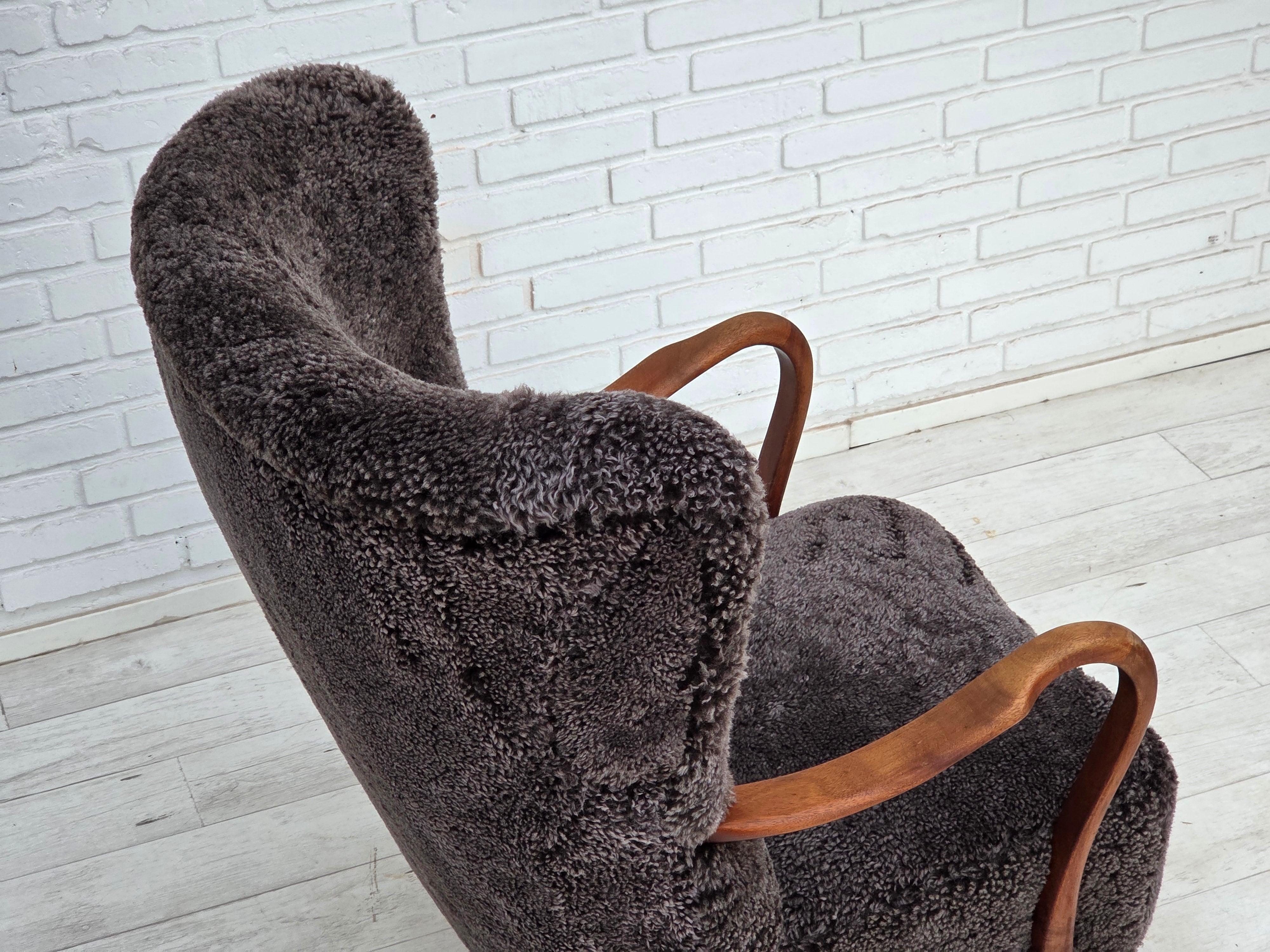 Danish_Mid-Century_Modern_Beech_Armchair_with_Genuine_Sheepskin_Upholstery_and_Leather_Buttons,_1960s