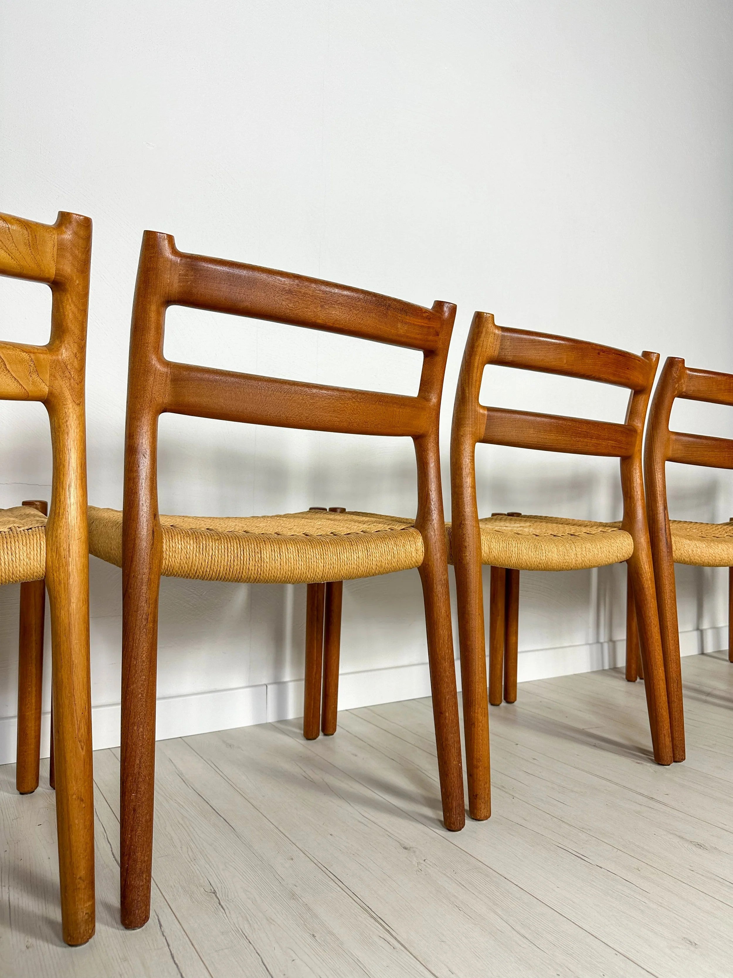 Set_of_6_Model_84_Teak_Dining_Chairs_by_Niels_Otto_Møller_for_J.L._Møller,_Papercord_Seats,_Denmark,_1960s