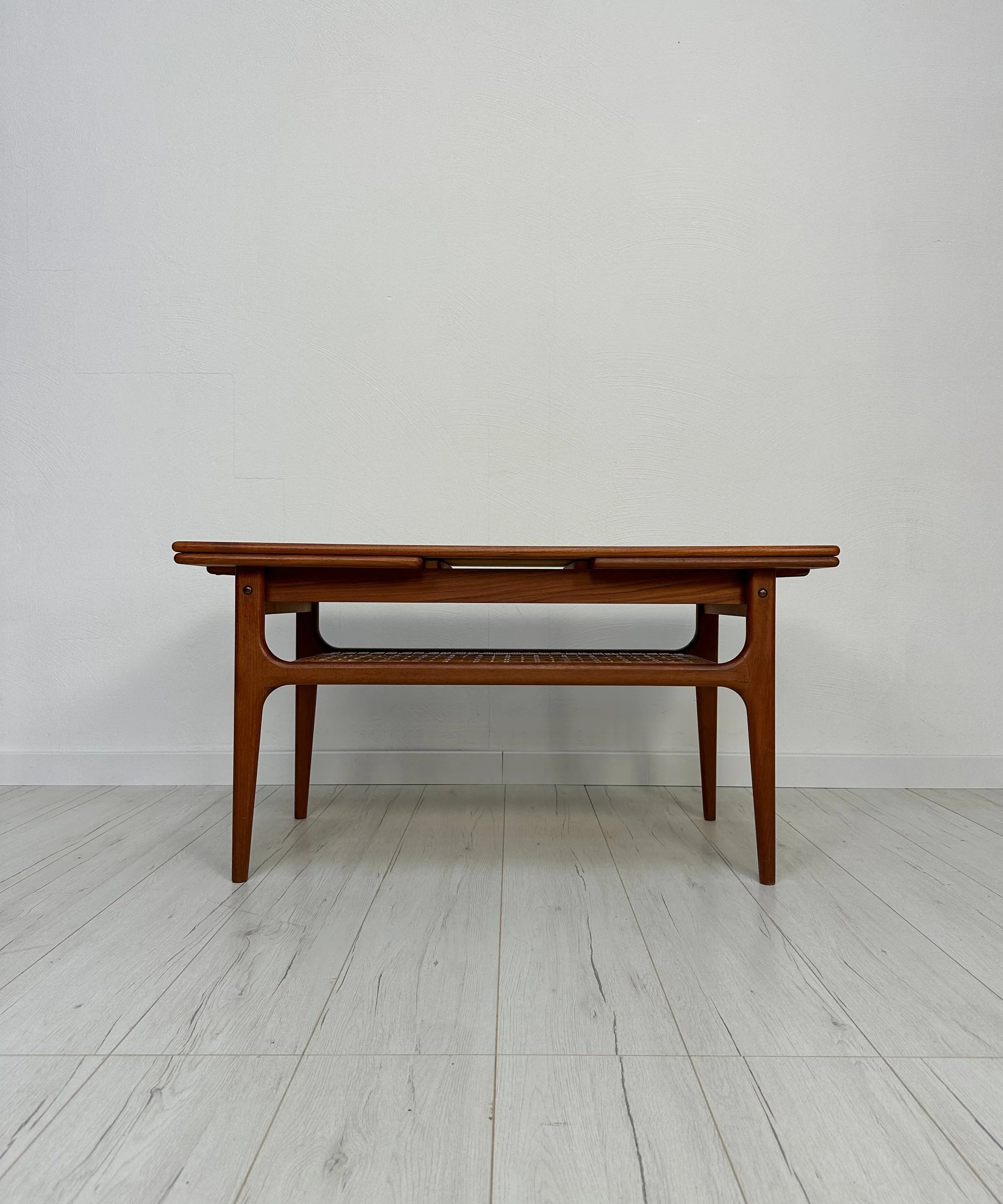 Danish_Extendable_Teak_Coffee_Table_with_Woven_Shelf_and_Pull-Out_Leaves,_Mid-Century_Modern,_1950s–1960s