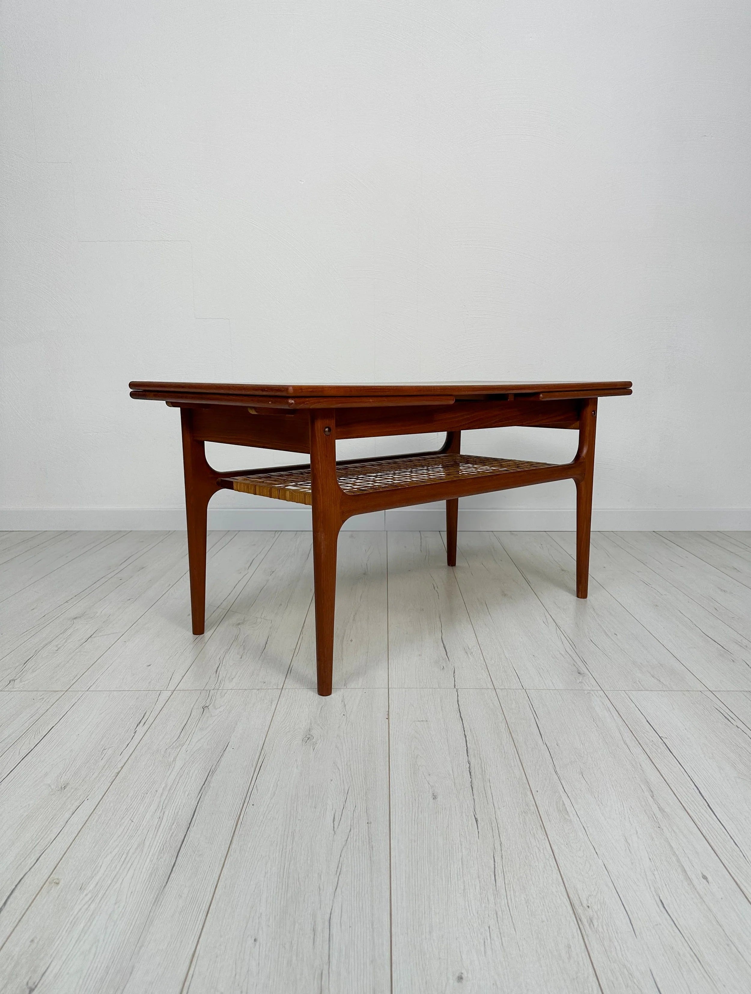 Danish_Extendable_Teak_Coffee_Table_with_Woven_Shelf_and_Pull-Out_Leaves,_Mid-Century_Modern,_1950s–1960s
