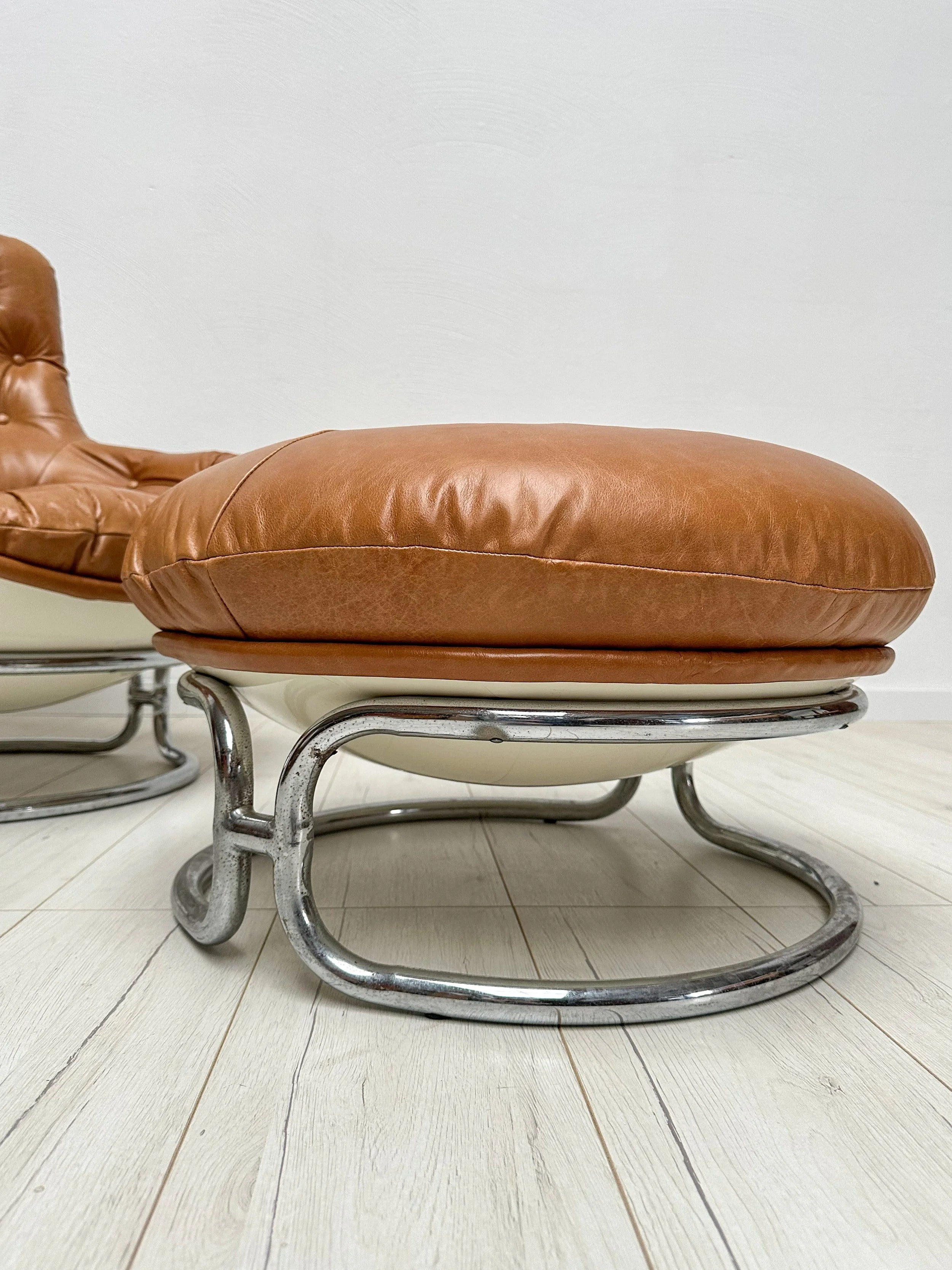 Set_of_Karate_Lounge_Chair_and_Ottoman_by_Michel_Cadestin_for_Airborne,_Cognac_Leather_and_White_Fibreglass,_France,_1960s