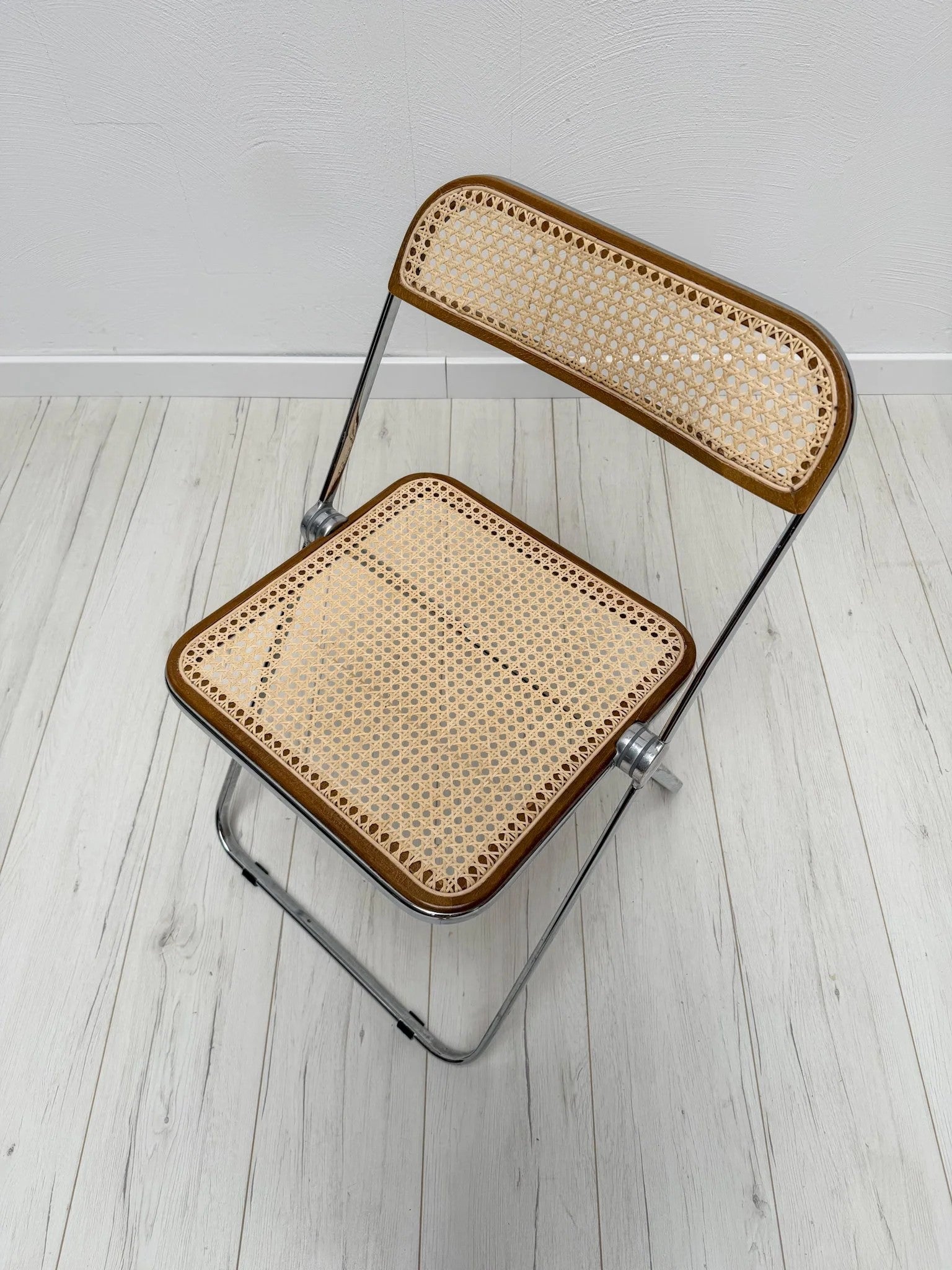 Plia_Folding_Chair_by_Giancarlo_Piretti_for_Anonima_Castelli,_Chrome,_Walnut_and_Cane_Wicker,_Italy,_1960s