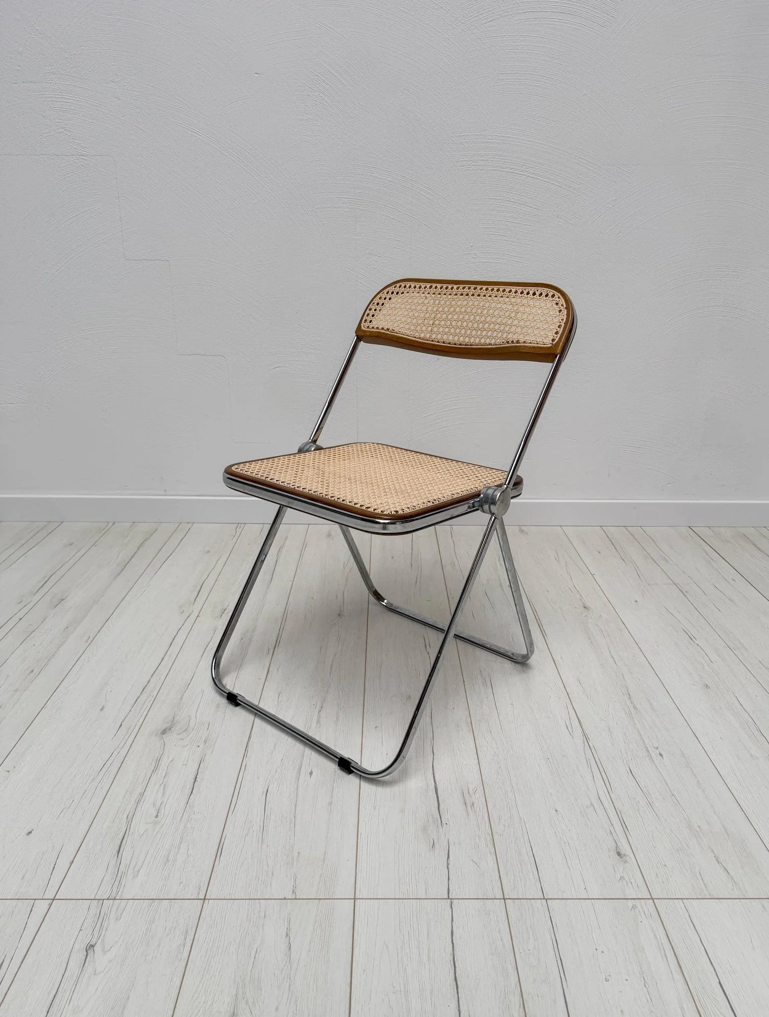 Plia_Folding_Chair_by_Giancarlo_Piretti_for_Anonima_Castelli,_Chrome,_Walnut_and_Cane_Wicker,_Italy,_1960s