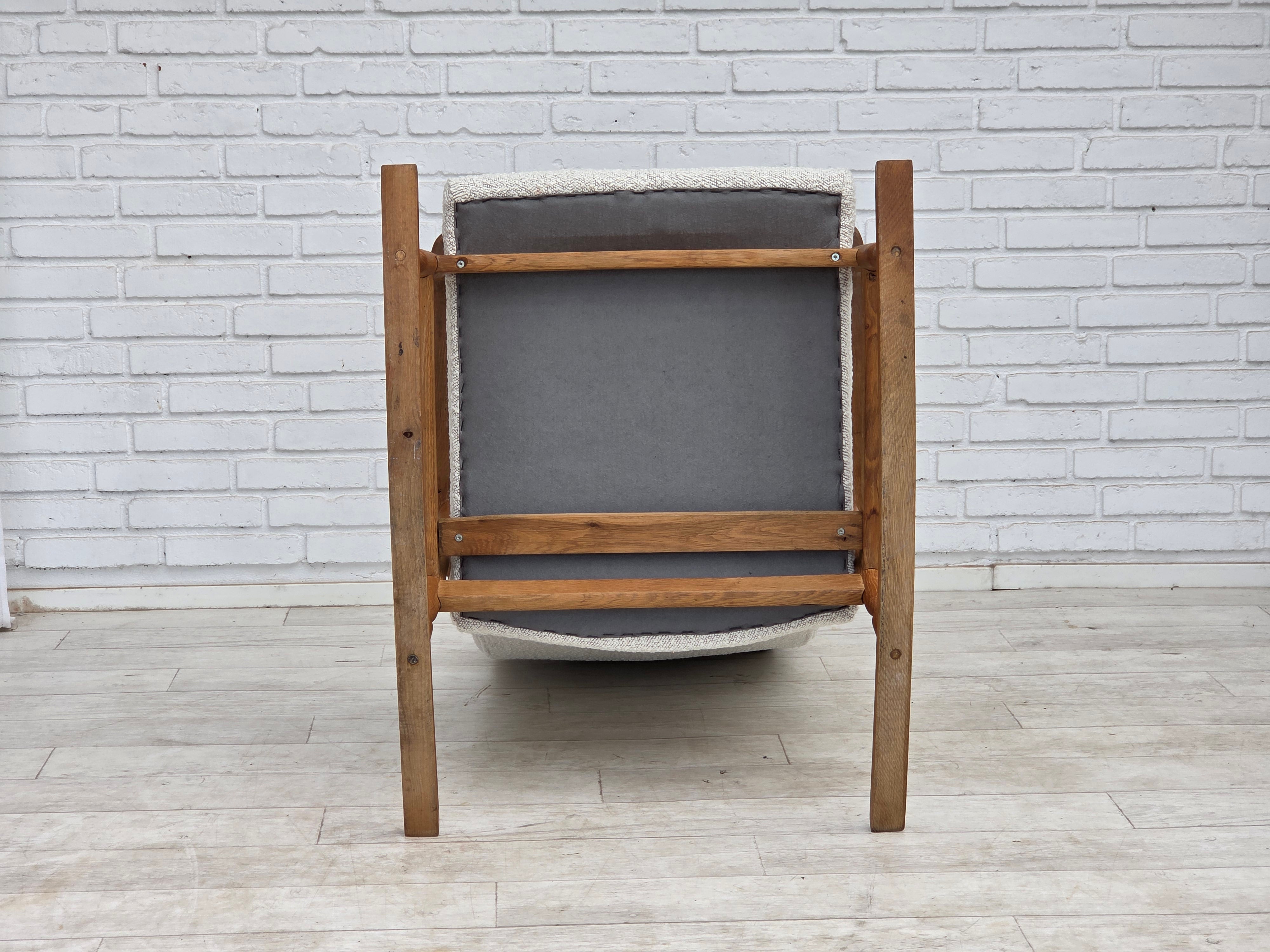 Scandinavian_High-Back_Rocking_Chair_in_Solid_Oak_with_White_Upholstery_and_Sheepskin_Pillow,_circa_1965–1970