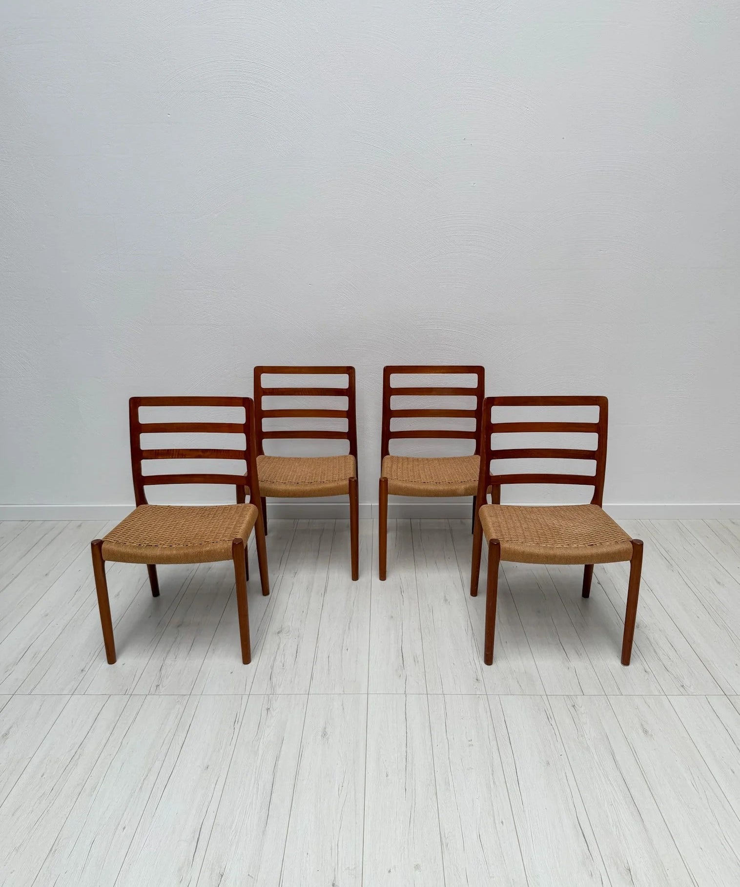 Set_of_4_Model_85_Dining_Chairs_by_Niels_Otto_Møller_for_J.L._Møllers,_Solid_Teak_and_Papercord,_Denmark,_1970s