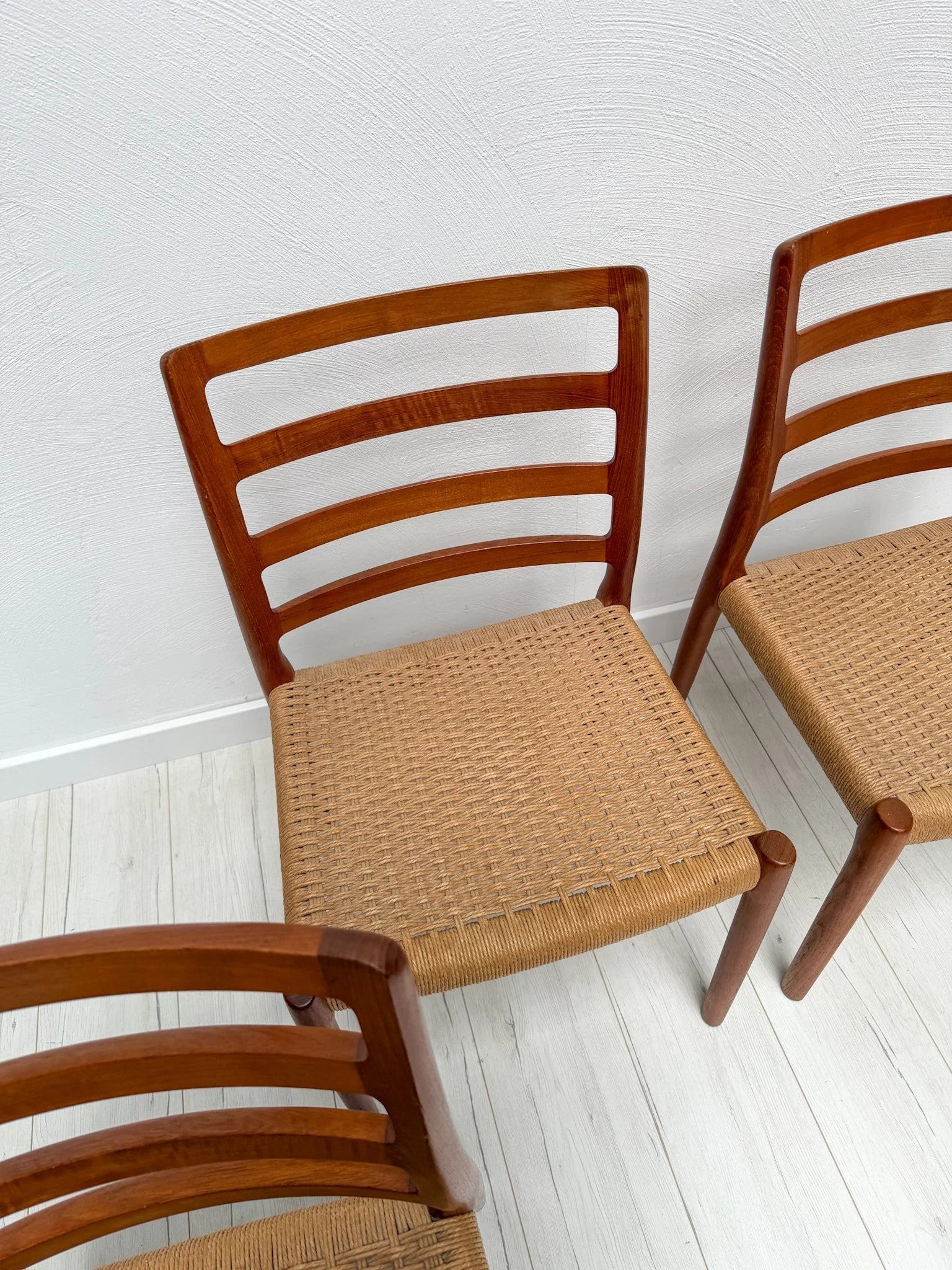 Set_of_4_Model_85_Teak_Dining_Chairs_by_Niels_Otto_Møller_for_J.L._Møllers_Møbelfabrik,_Denmark,_1970s
