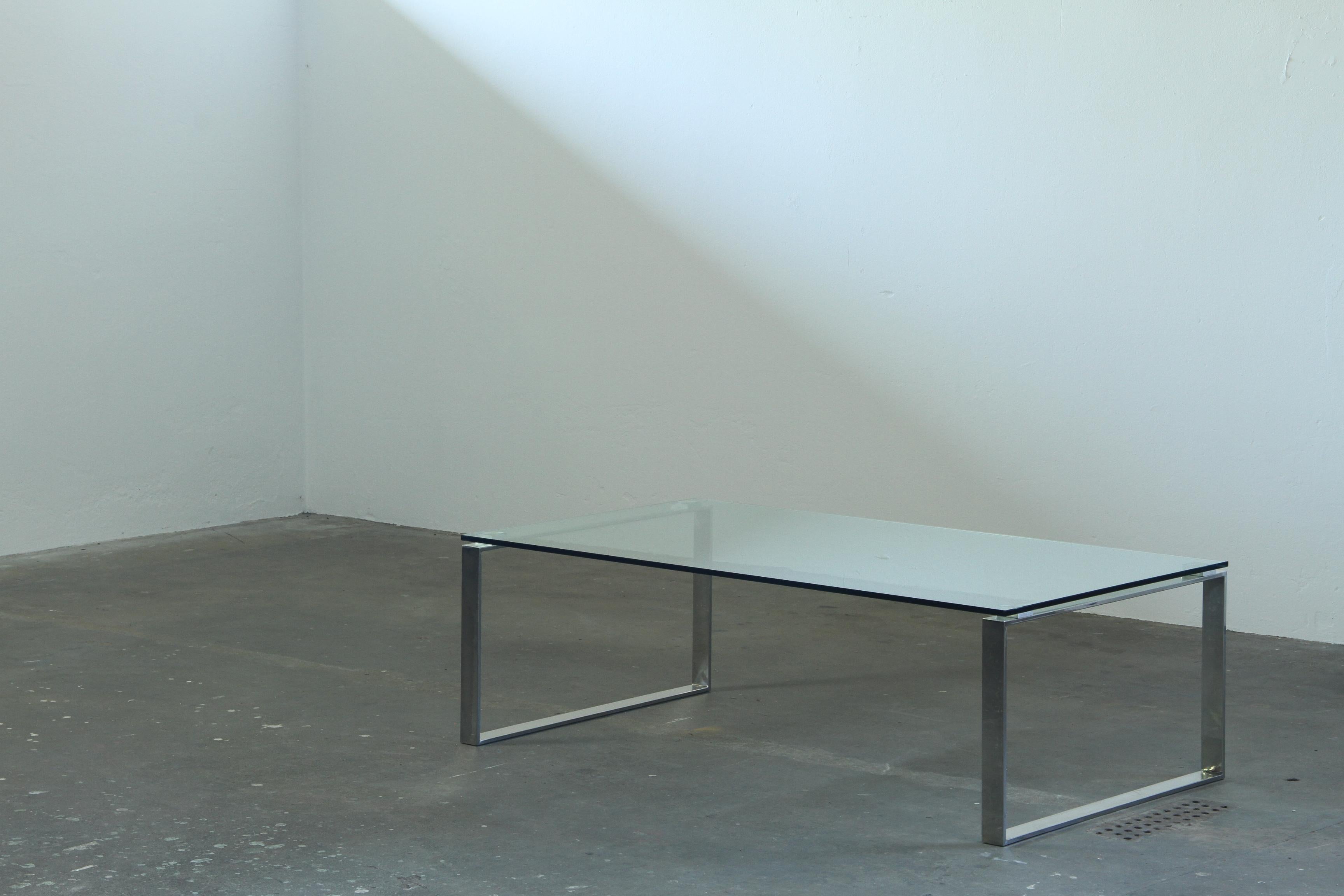 Danish_Modern_Glass_and_Chrome_Coffee_Table_with_Sled_Base,_1990s