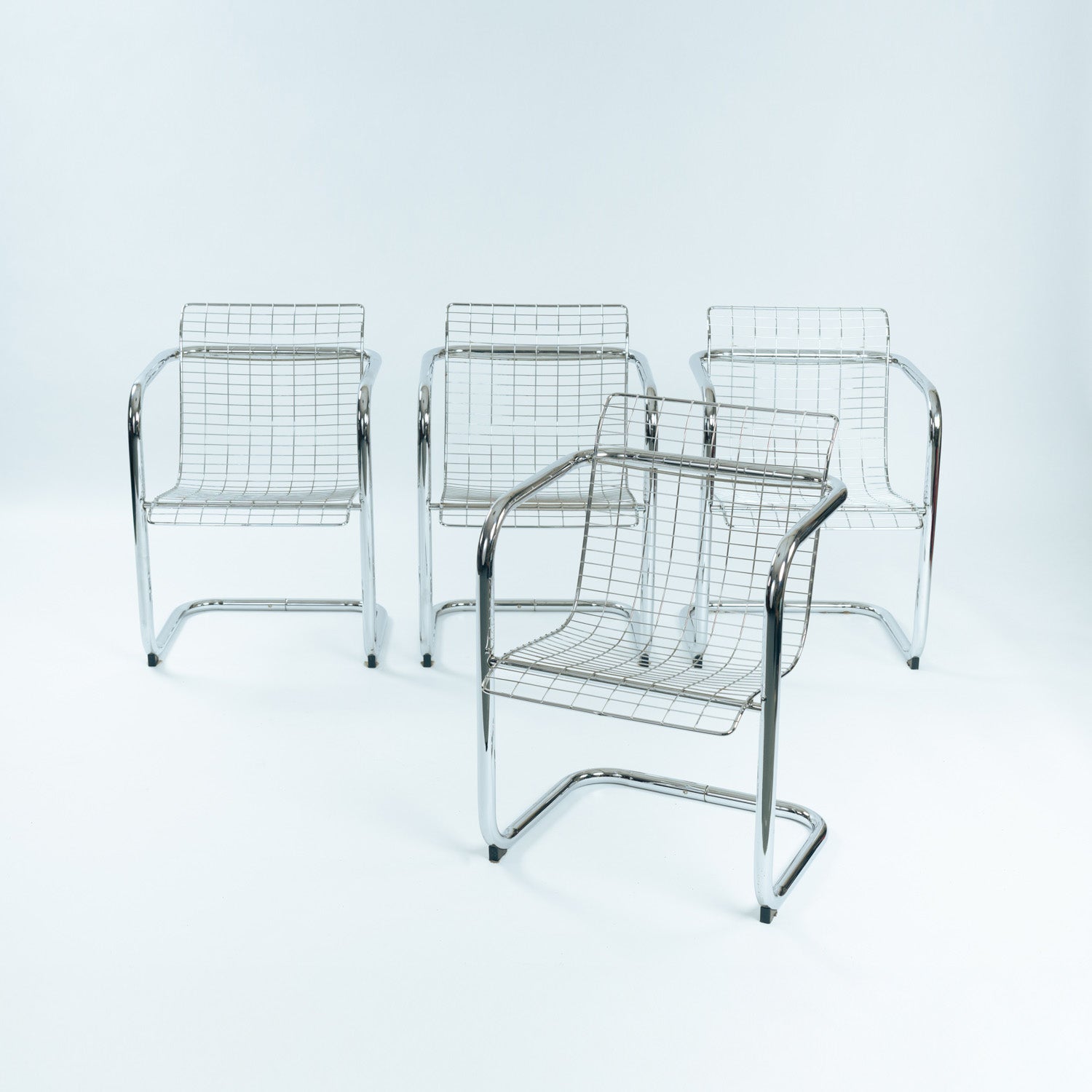 Set_of_4_Vintage_Cantilever_Wire_Dining_Chairs,_Minimalist_Modern_Design