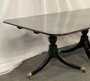 Hollywood_Regency_Triple_Pedestal_Ebony_Dining_Table,_Maison_Jansen_1920s