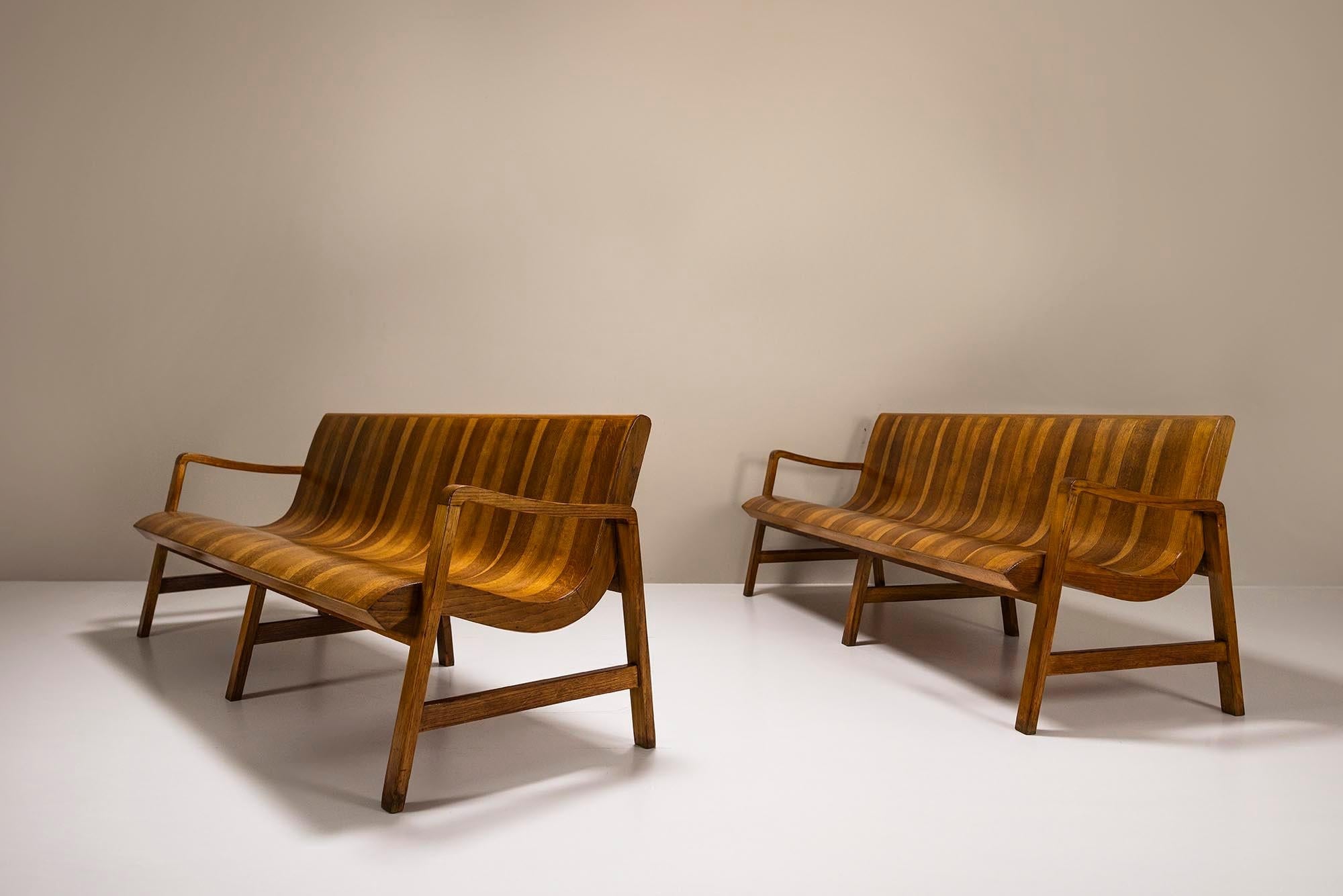 Two_Wave-Shaped_Benches_in_Walnut_with_Two-tone_Veneering,_Italy_1950s