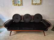 A_rare_stylish_sofa_by,_Midcentury_Modern._Re-upholstered_in_black_velvet