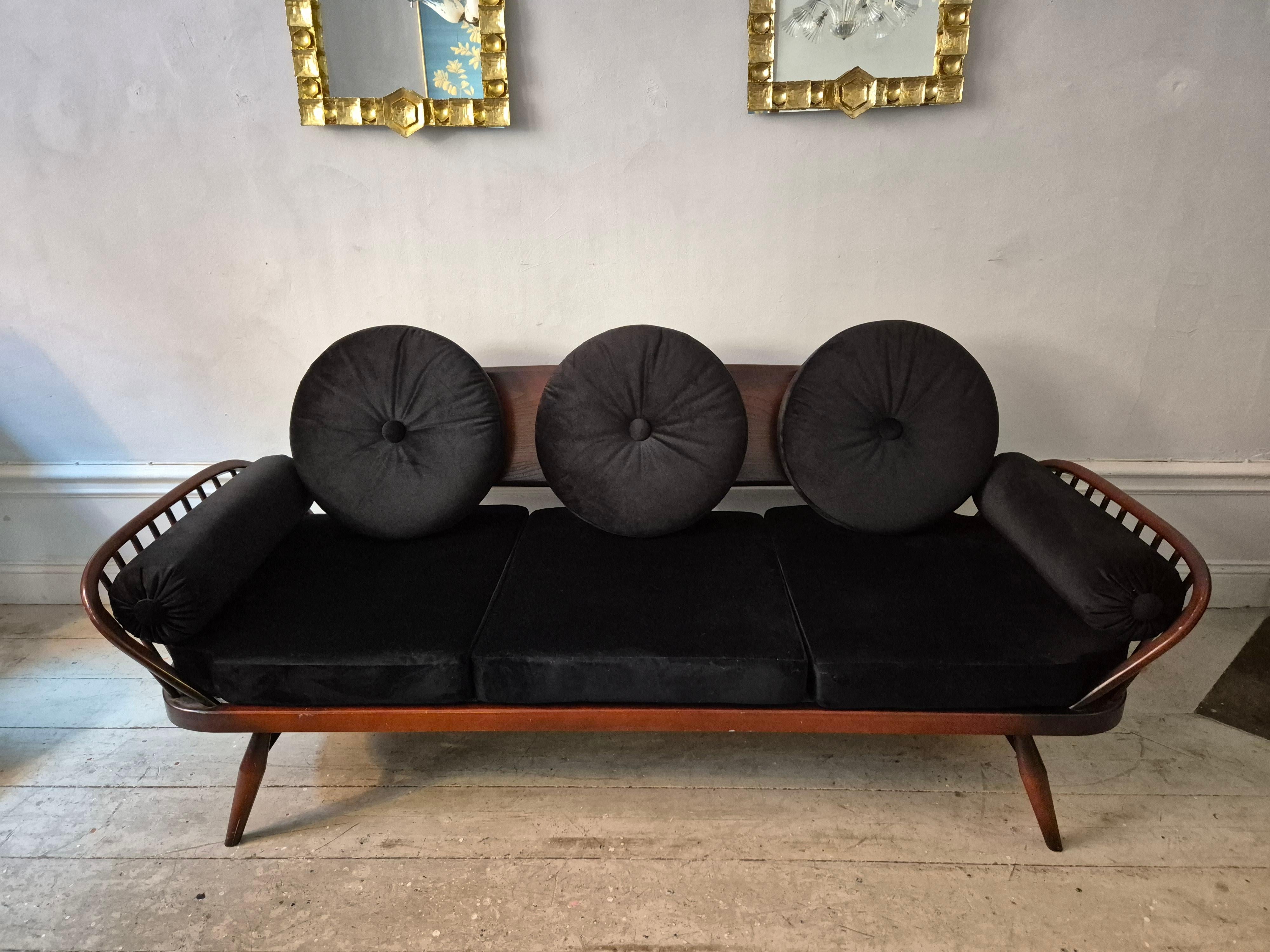 A_rare_stylish_sofa_by,_Midcentury_Modern._Re-upholstered_in_black_velvet