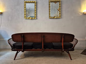 A_rare_stylish_sofa_by,_Midcentury_Modern._Re-upholstered_in_black_velvet