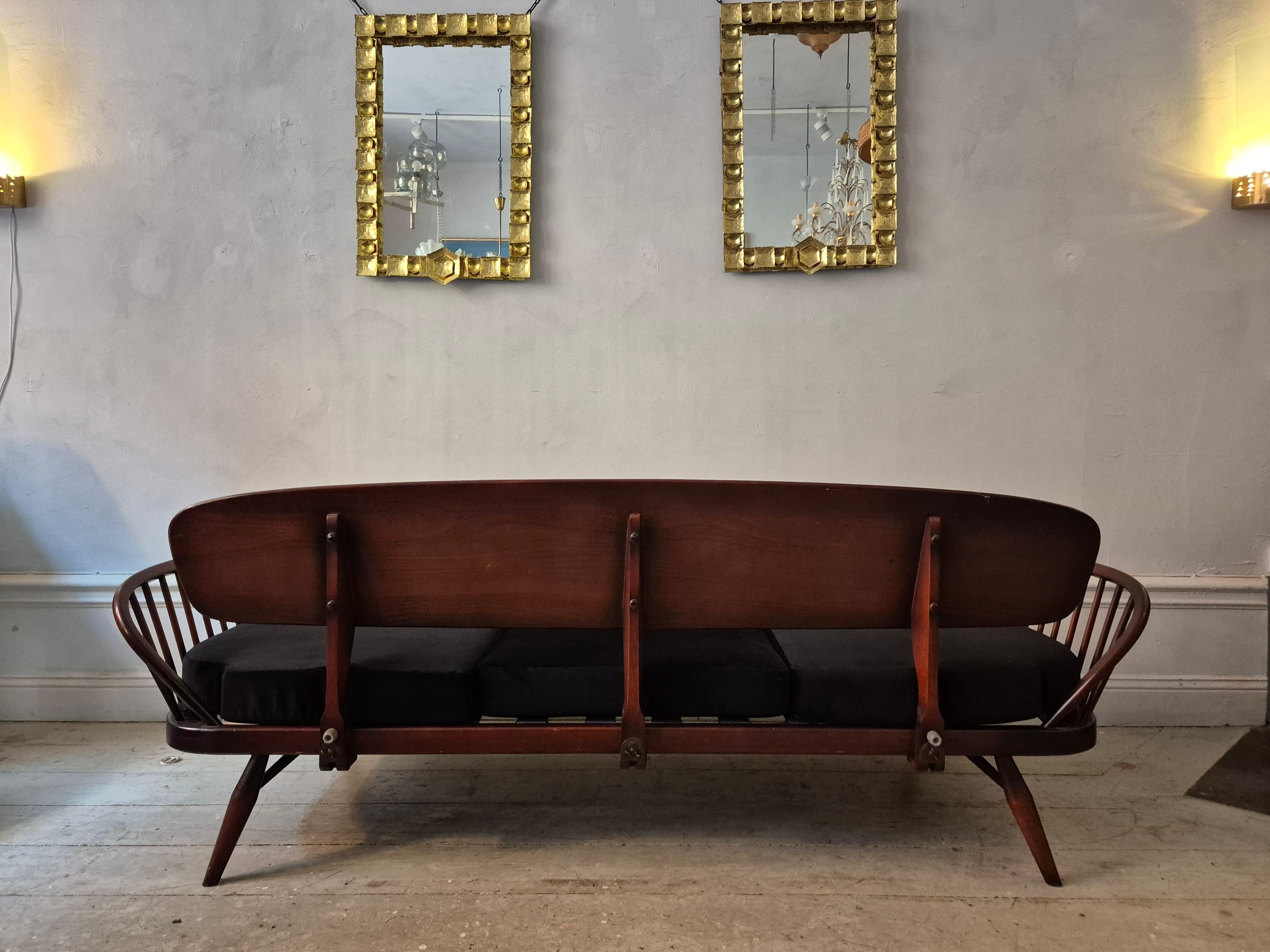 A_rare_stylish_sofa_by,_Midcentury_Modern._Re-upholstered_in_black_velvet
