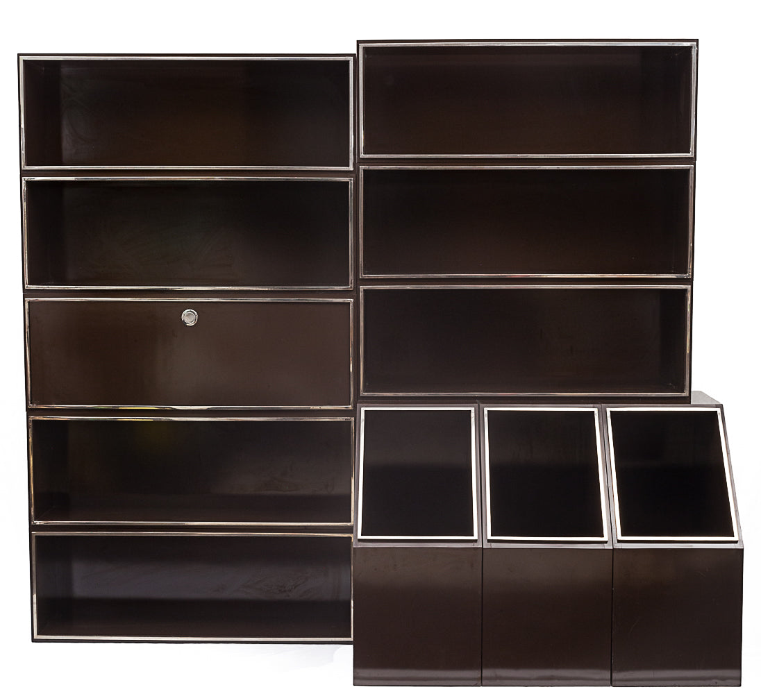 Laminated_wood_bookcase_with_chrome-plated_metal_moldings.