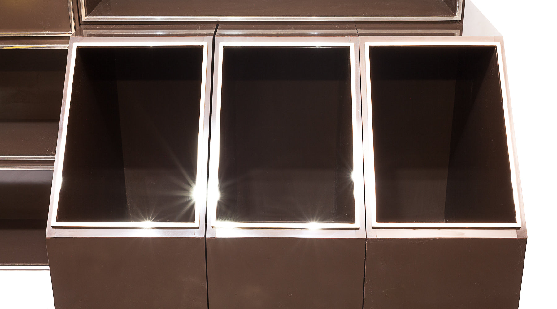 Laminated_wood_bookcase_with_chrome-plated_metal_moldings.