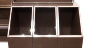 Laminated_wood_bookcase_with_chrome-plated_metal_moldings.