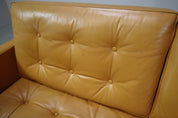 Florence_Knoll_two-seater_sofa_in_mustard_yellow_leather,_1970