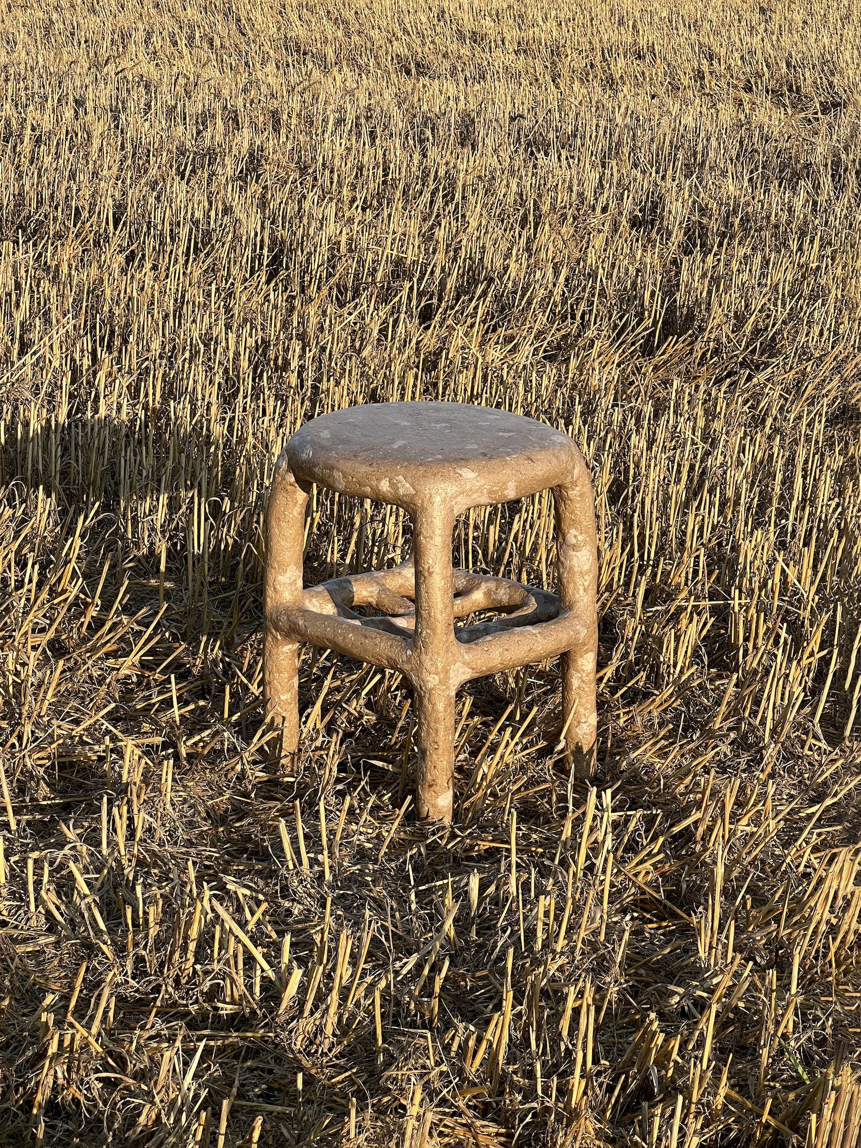 Brown_terazzo_papier-mache_stool_or_table