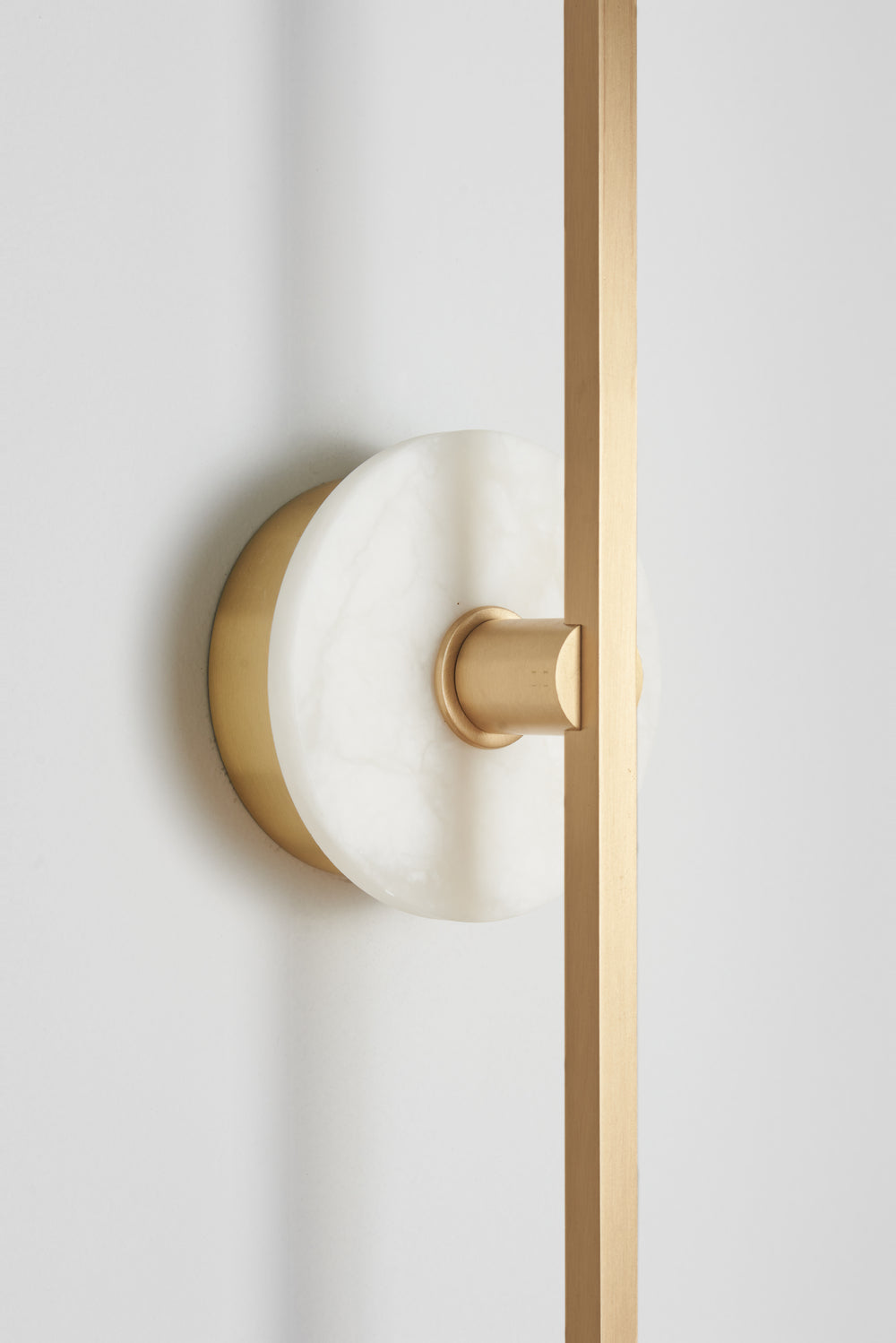 Essential_Stick_wall_sconce_in_Brass_and_Alabaster