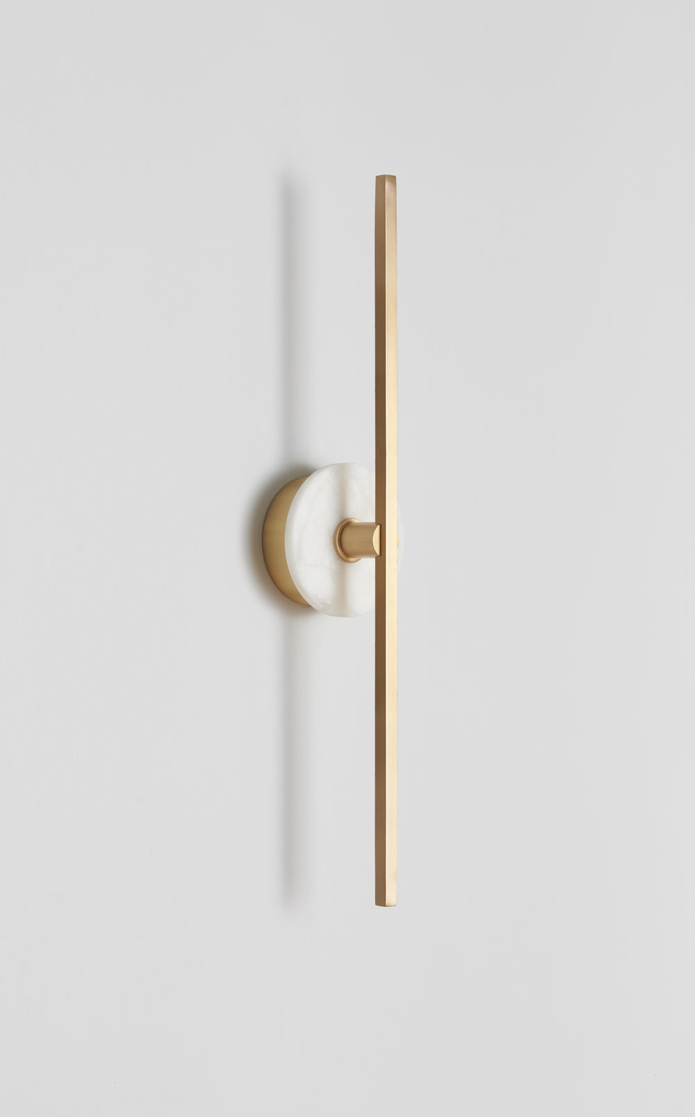 Essential_Stick_wall_sconce_in_Brass_and_Alabaster