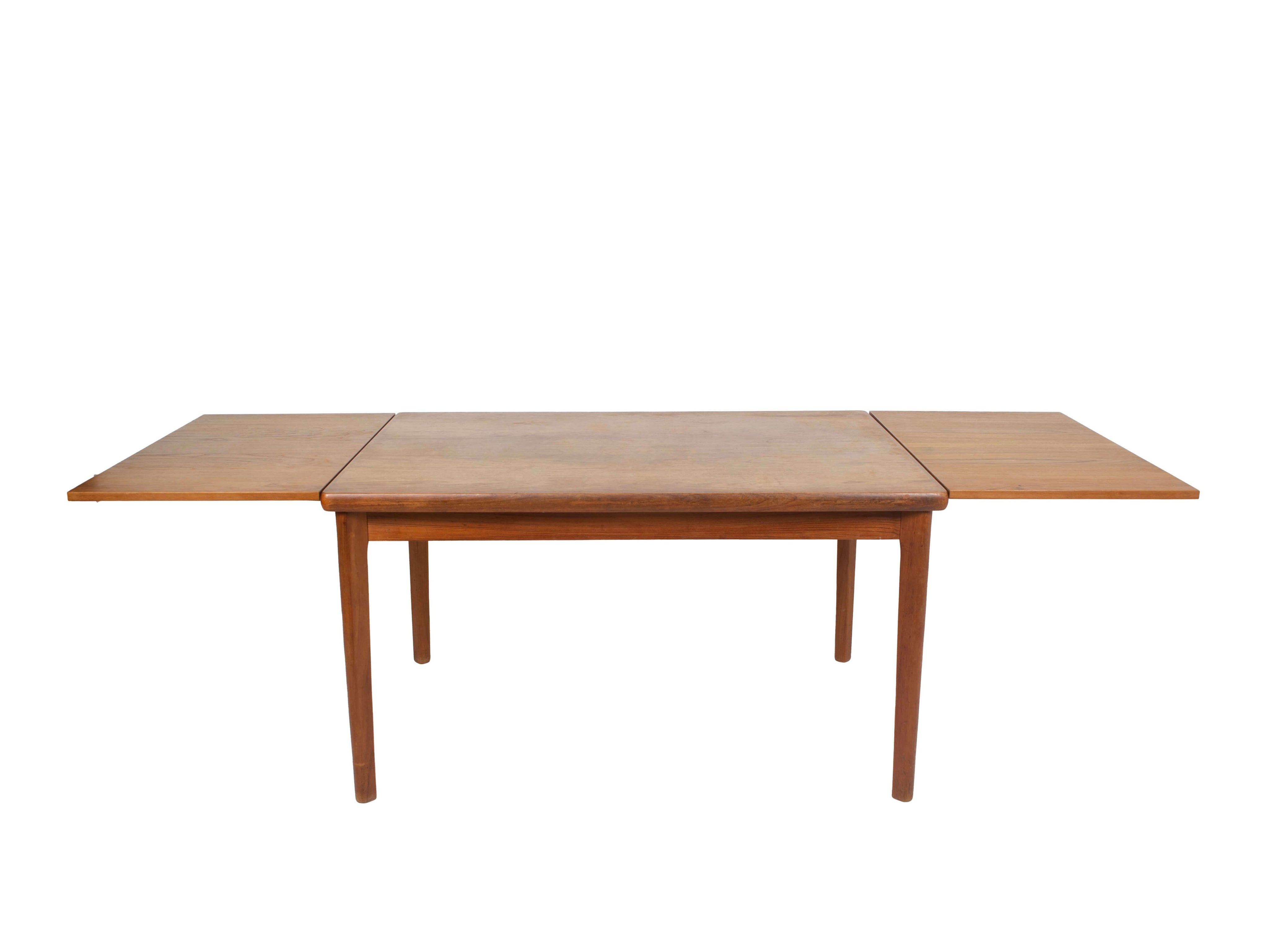 Extendable_Teak_Dining_Table_by_Henning_Kjaernulf_Denmark_1960s