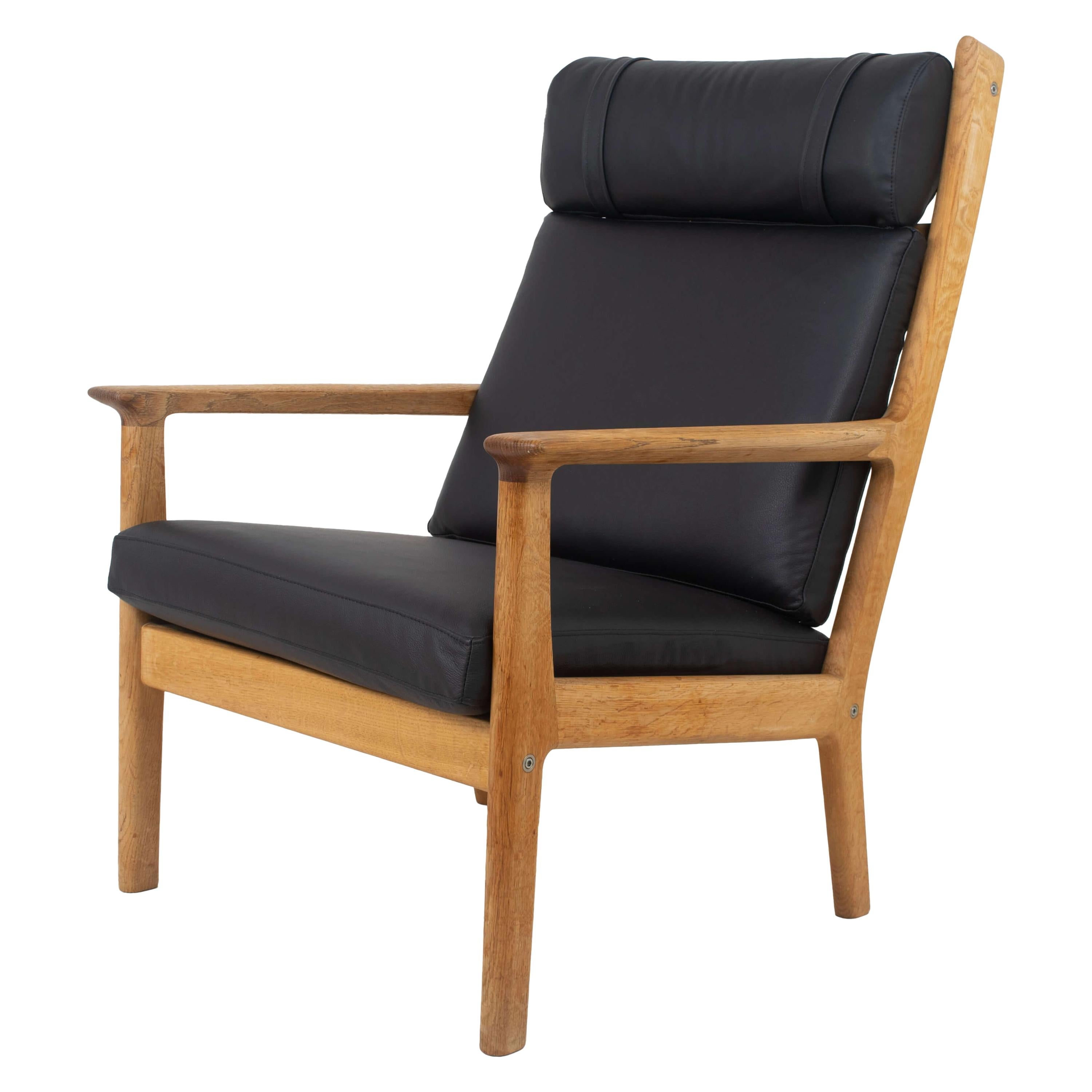 Hans_Wegner_Fauteuil_GE_265_for_GETAMA_in_Oak_and_Black_Leather_1980
