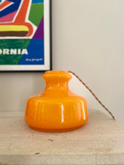 Pop_hanging_lamp_in_bright_orange_glass_from_1960
