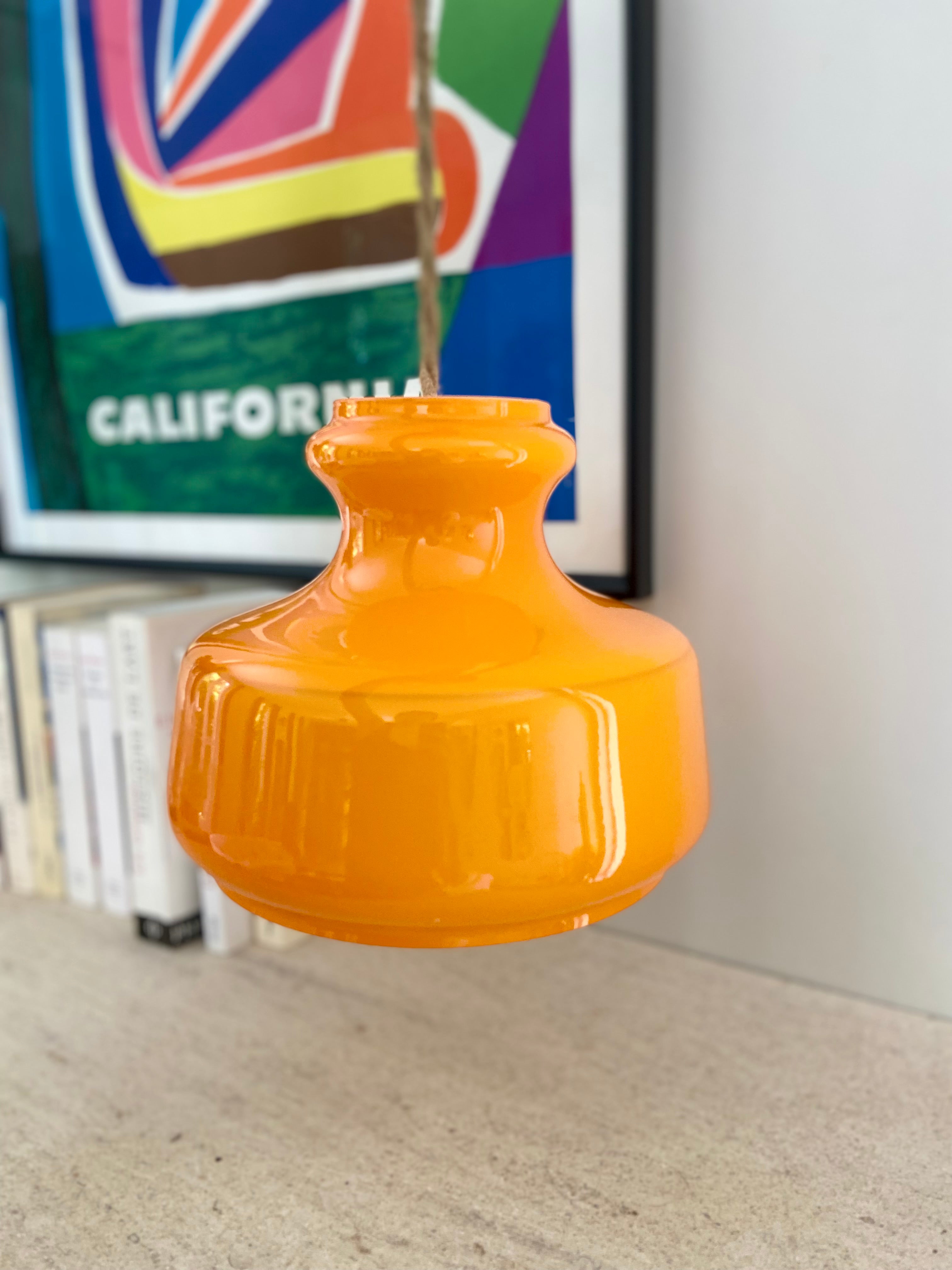 Pop_hanging_lamp_in_bright_orange_glass_from_1960