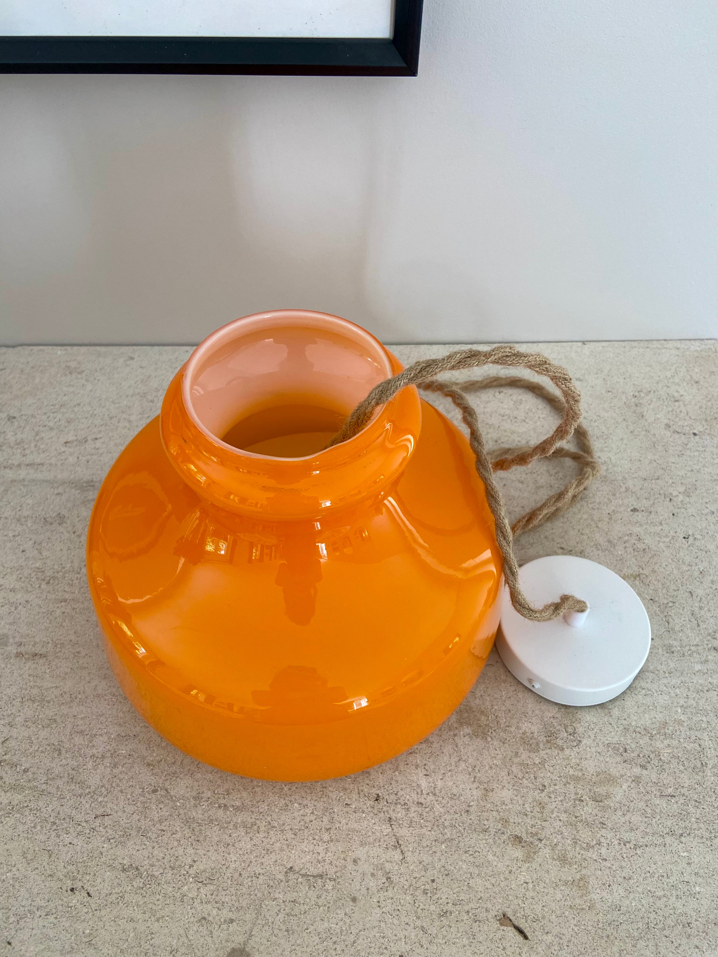 Pop_hanging_lamp_in_bright_orange_glass_from_1960
