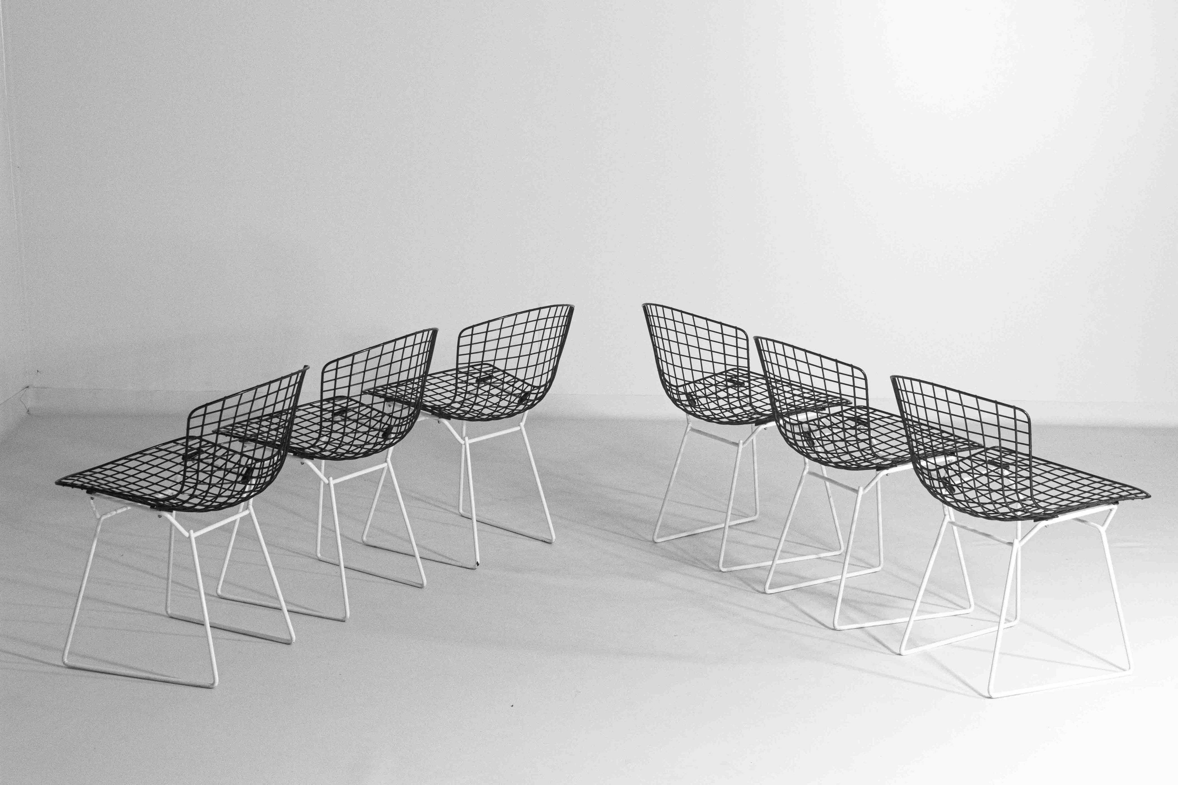 Set_of_7_Black_and_White_wire_chairs_by_Harry_Bertoia_for_Knoll_International_1970