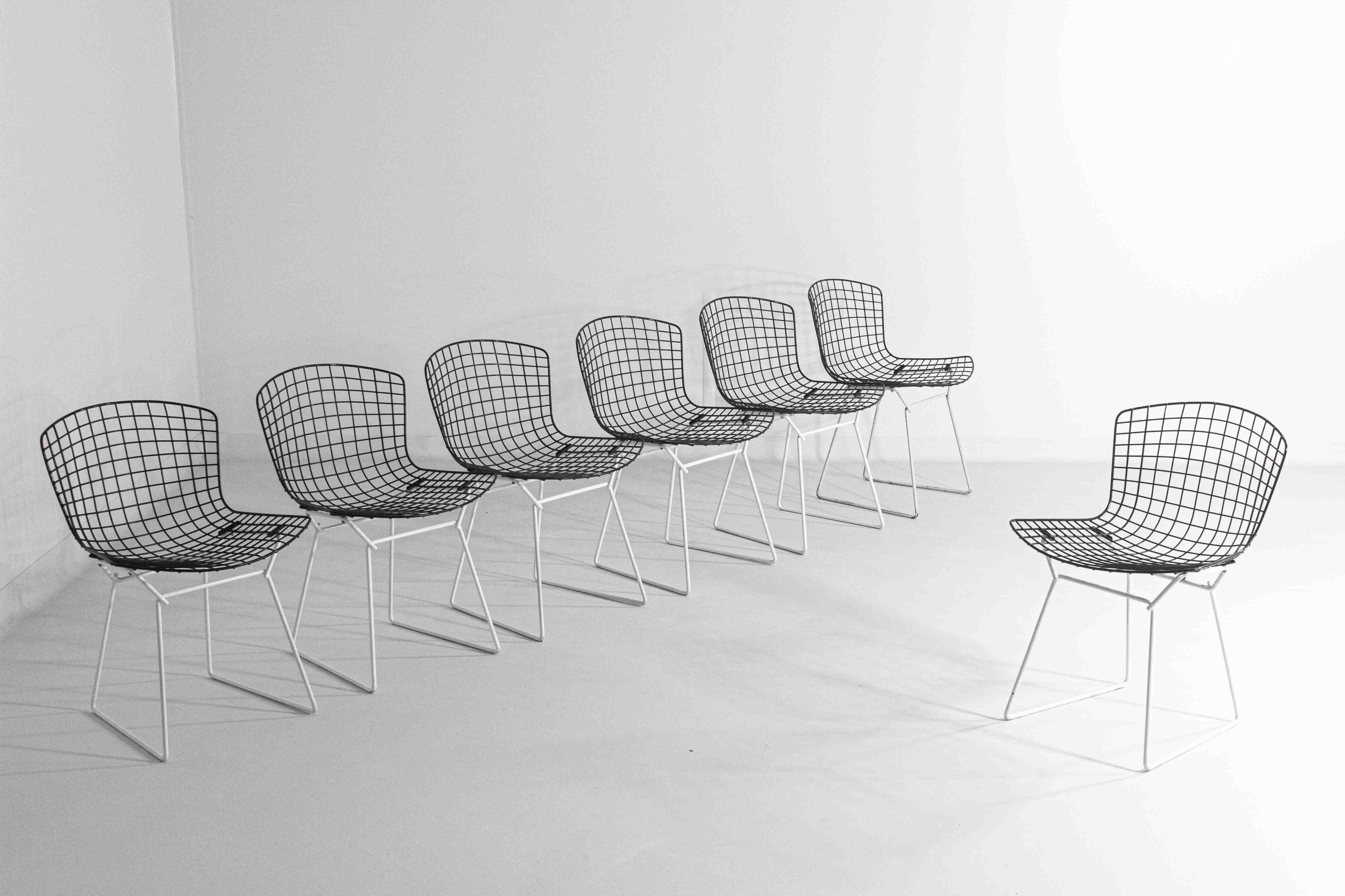 Set_of_7_Black_and_White_wire_chairs_by_Harry_Bertoia_for_Knoll_International_1970