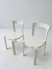 Set_of_two_white_Poli_model_3700_stacking_chairs_from_Dietiker_1993s