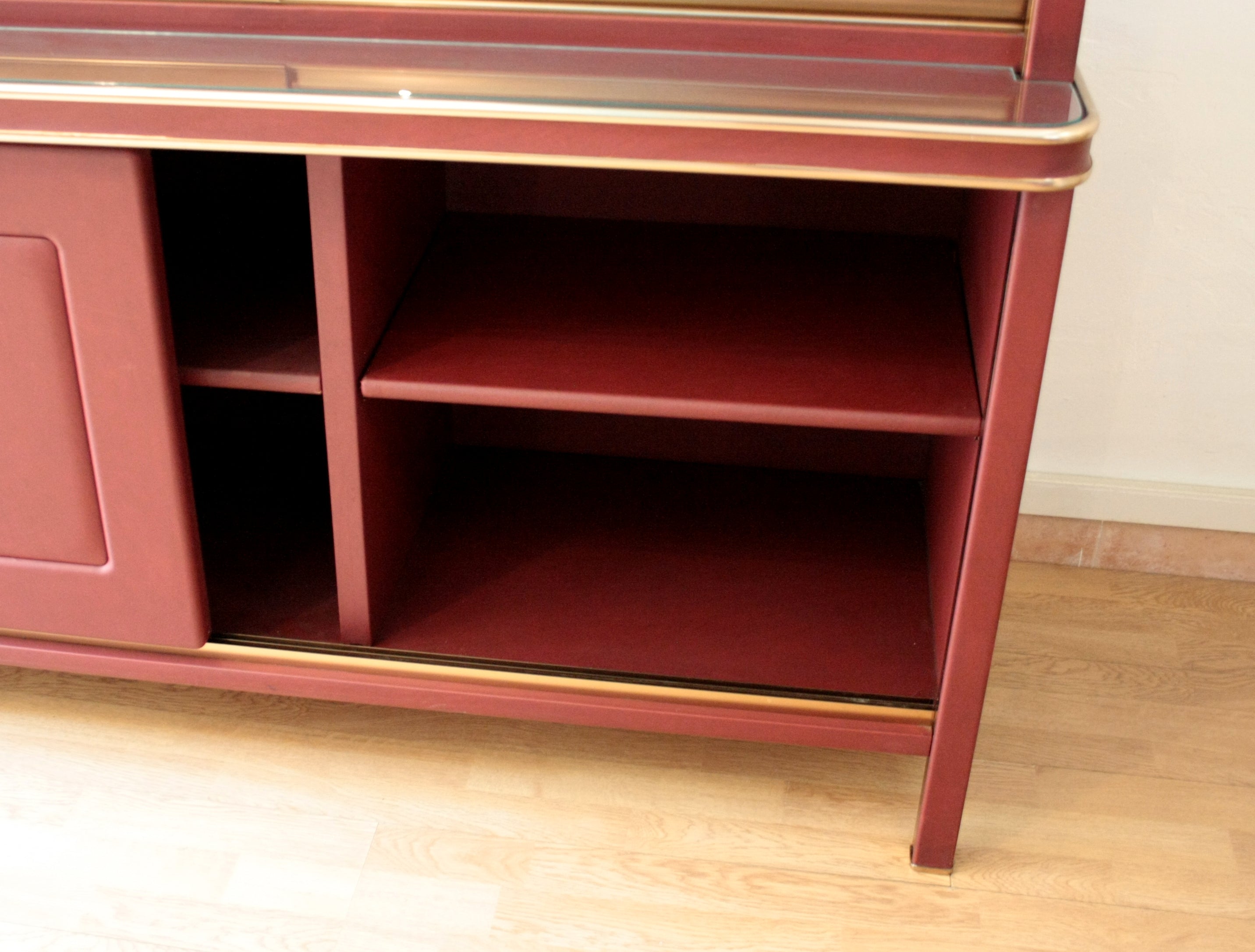 Sideboard_or_double-body_bookcase_covered_in_burgundy_imitation_leather_by_Umberto_Mascagni,_1950s