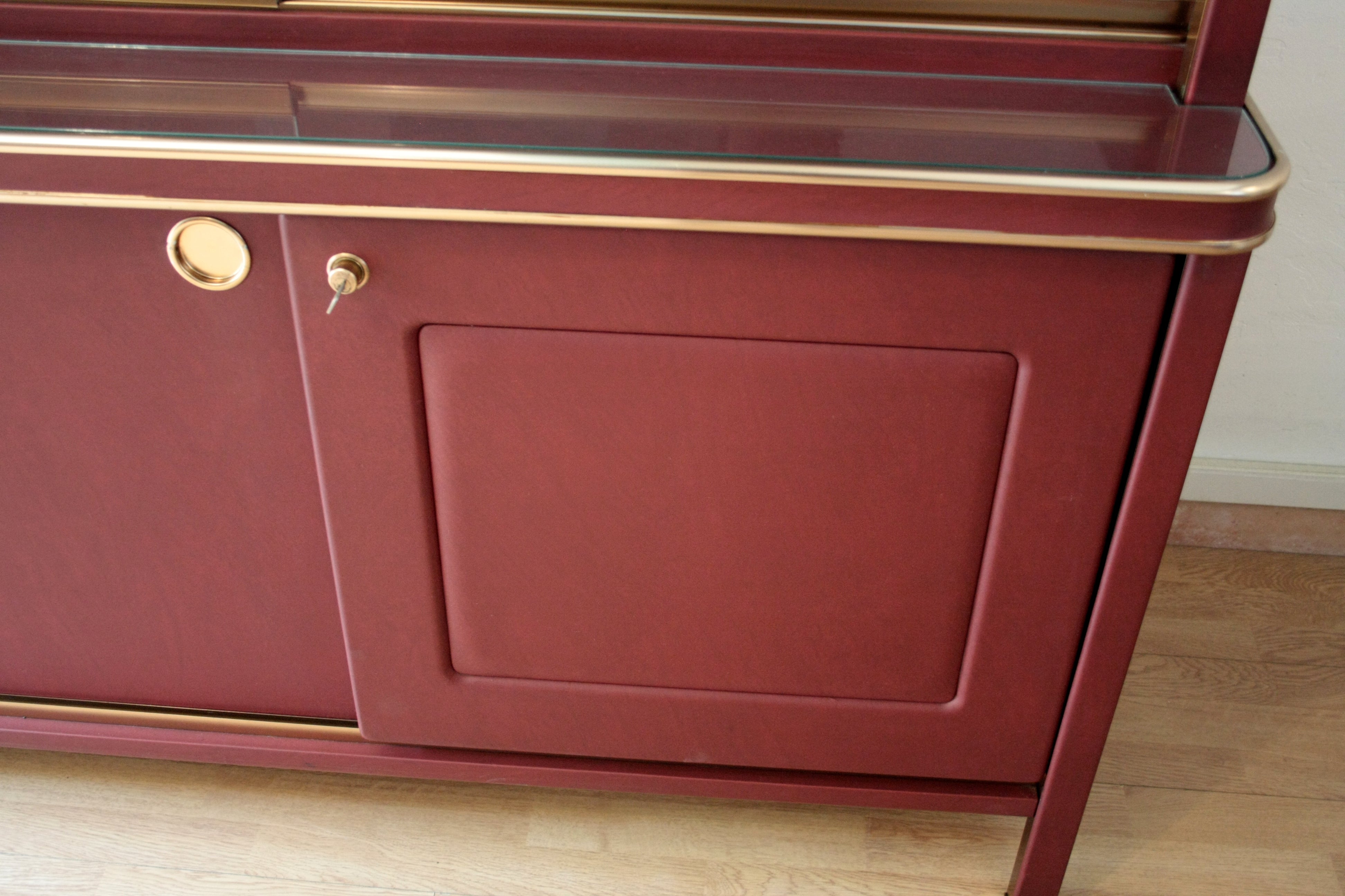 Sideboard_or_double-body_bookcase_covered_in_burgundy_imitation_leather_by_Umberto_Mascagni,_1950s