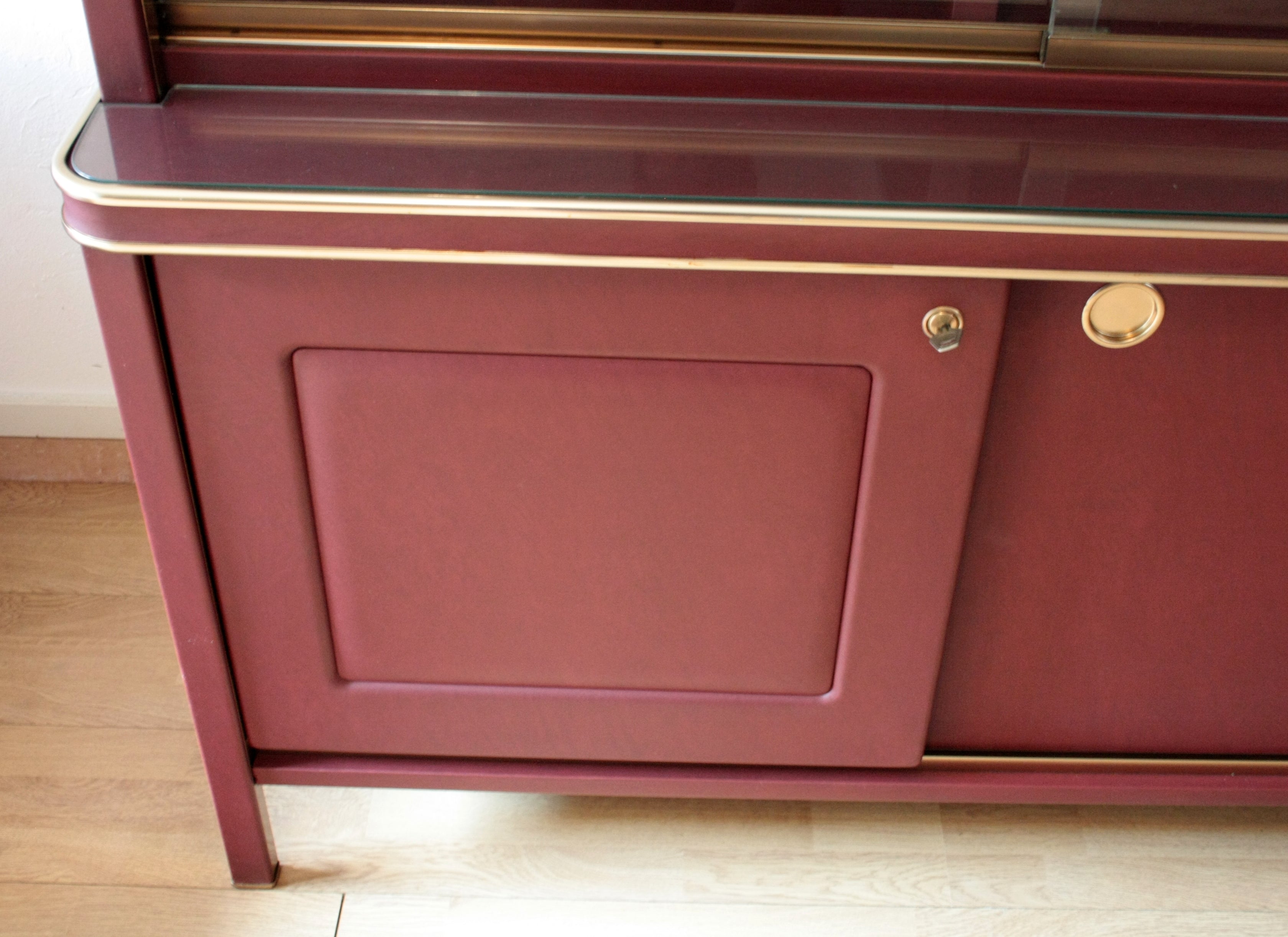 Sideboard_or_double-body_bookcase_covered_in_burgundy_imitation_leather_by_Umberto_Mascagni,_1950s