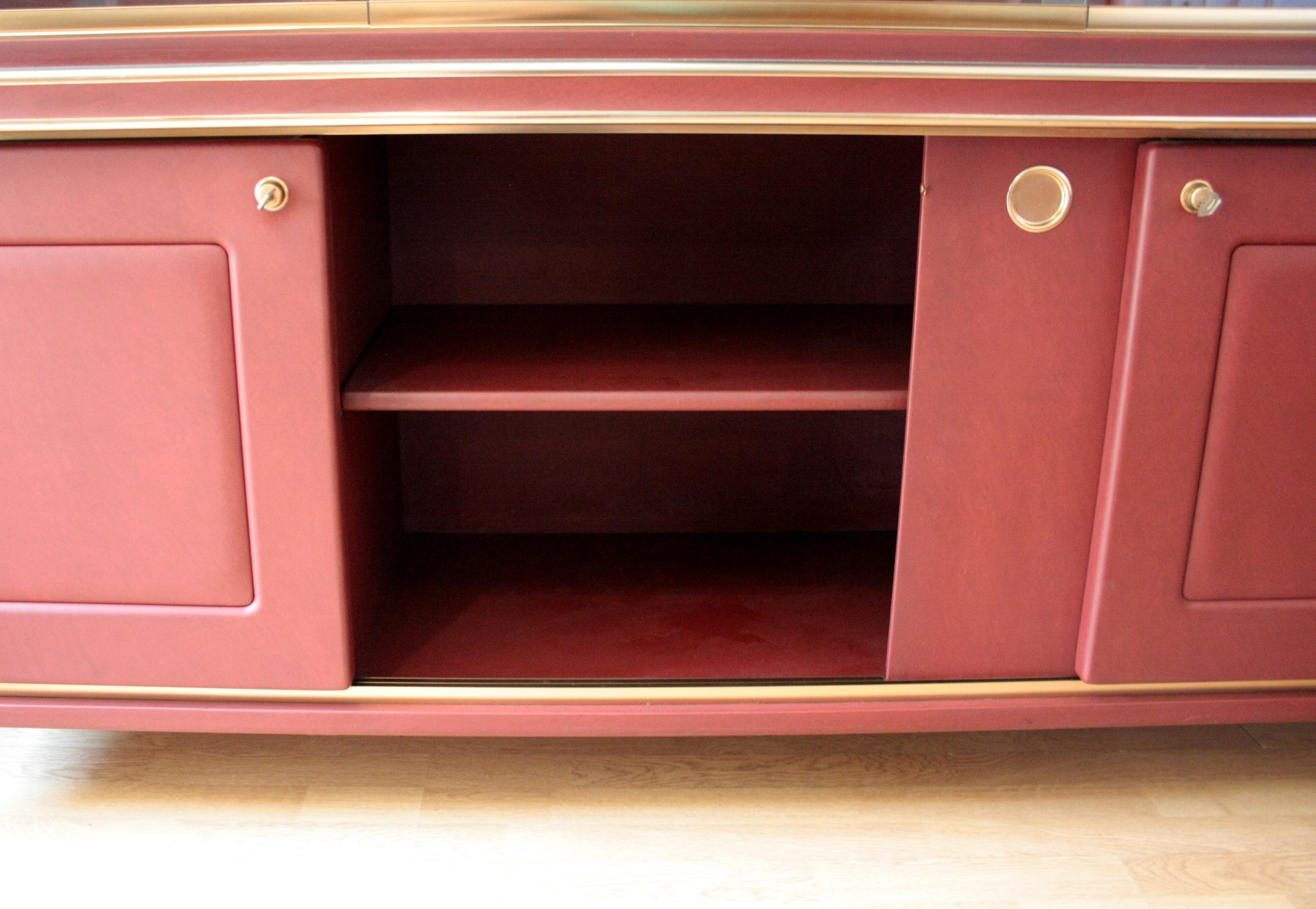 Sideboard_or_double-body_bookcase_covered_in_burgundy_imitation_leather_by_Umberto_Mascagni,_1950s