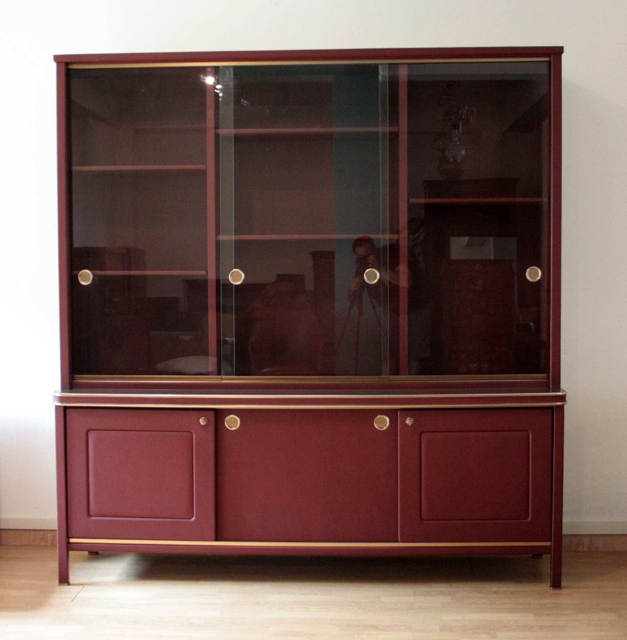 Sideboard_or_double-body_bookcase_covered_in_burgundy_imitation_leather_by_Umberto_Mascagni,_1950s
